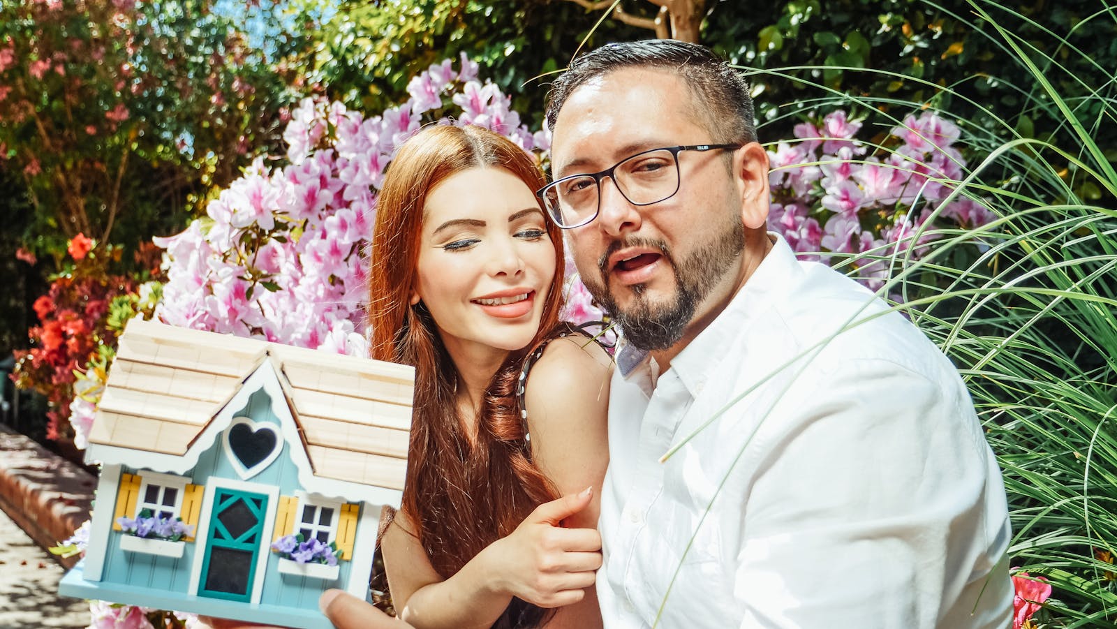 A couple sitting together at home researching the home buying process on a laptop