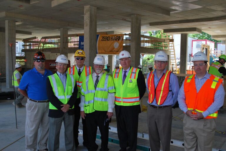 General contractor local SEO - contractors reviewing plans at job site