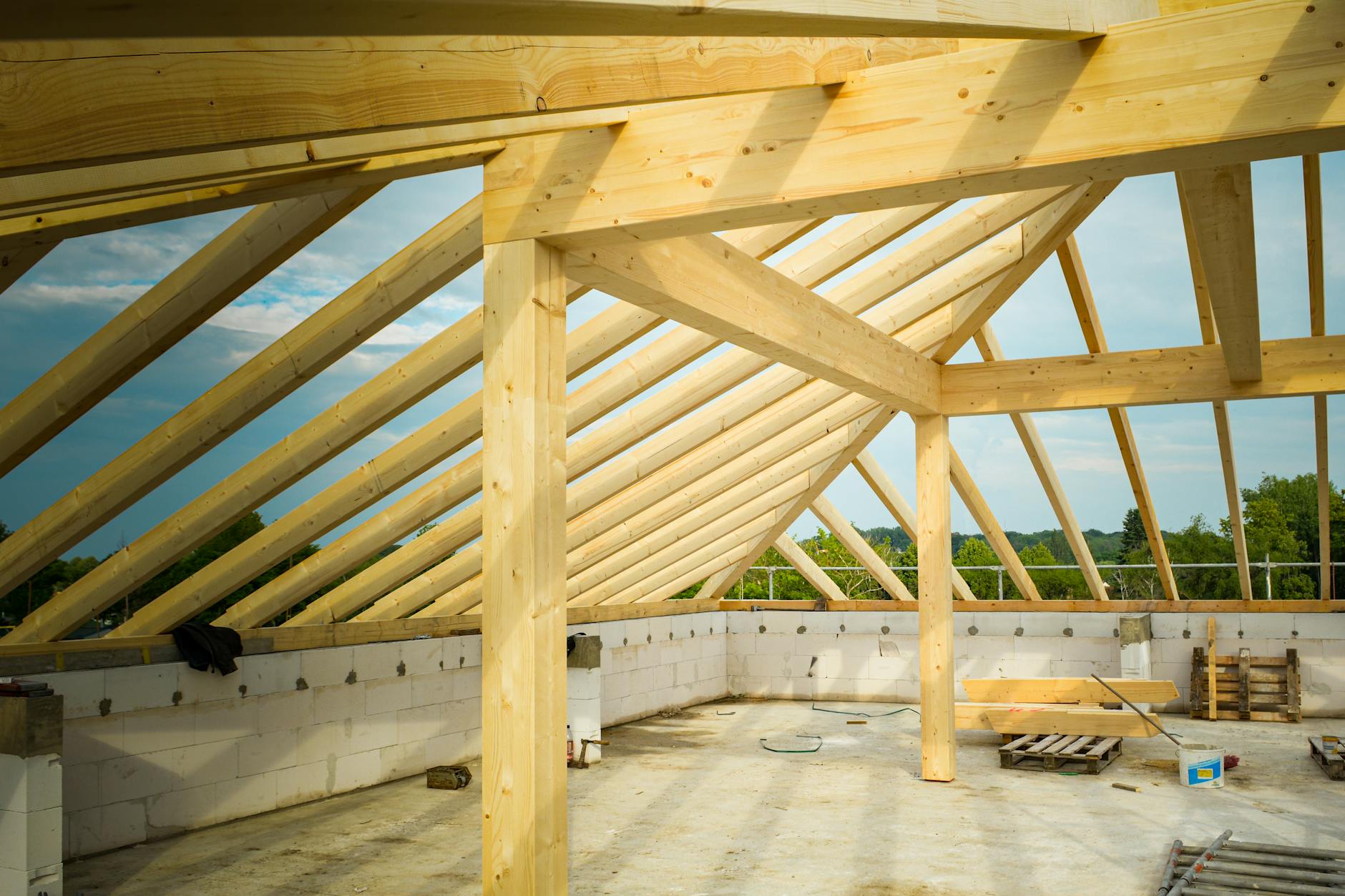 Wooden trusses and roof framing on a new construction project