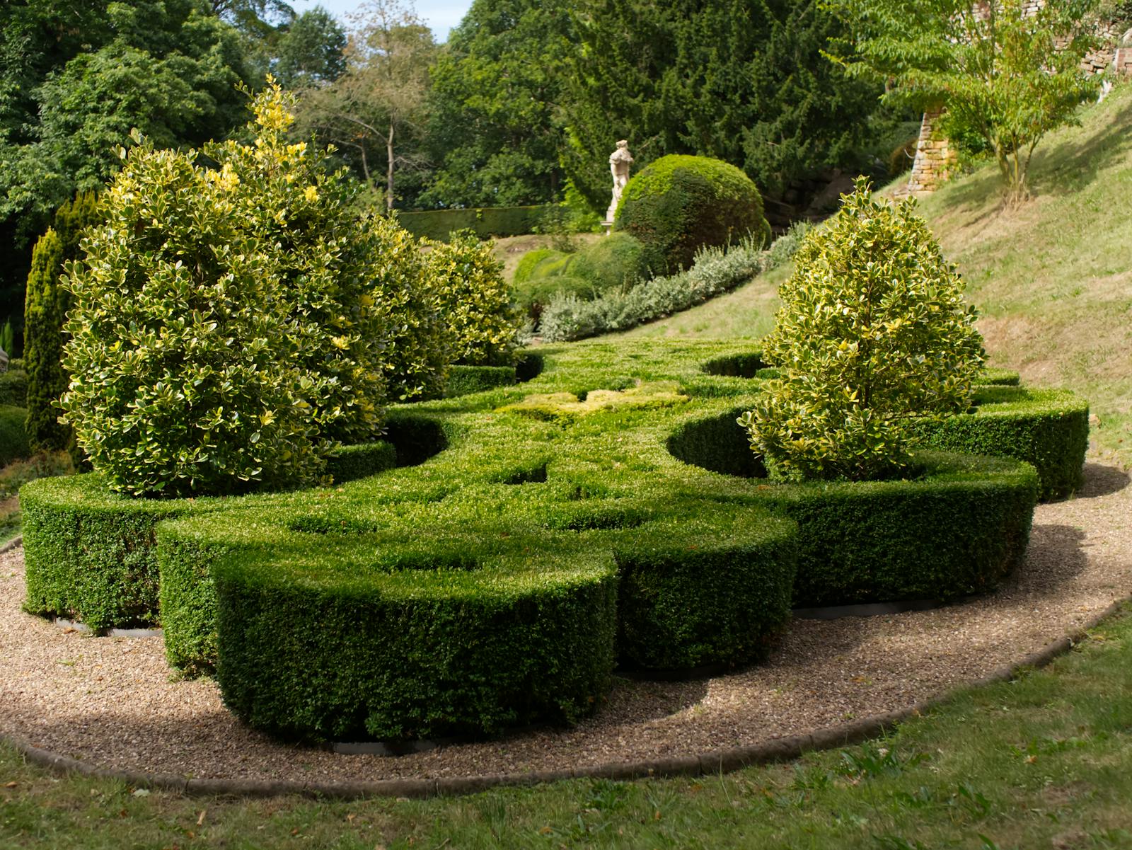 Manicured topiary garden — the high-end landscape design work that earns premium pricing online