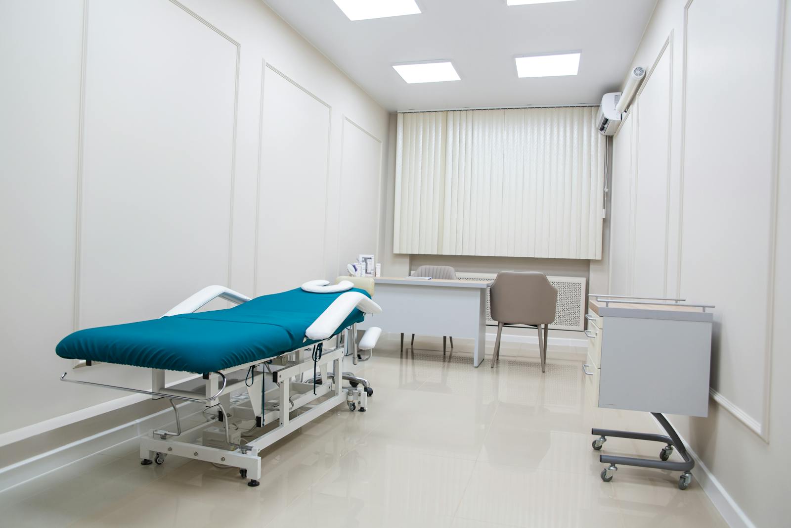 Modern aesthetic clinic treatment room with clean medical equipment