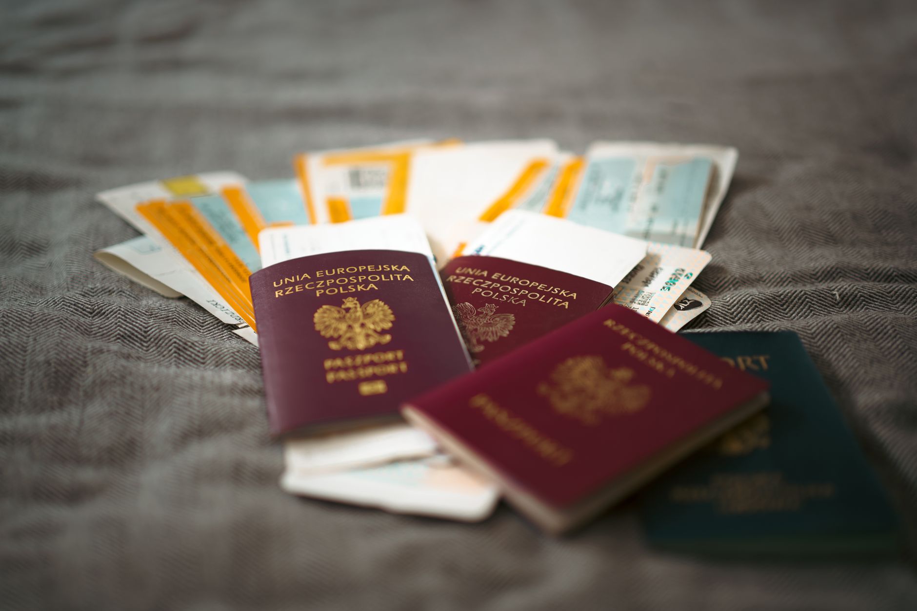 Stack of passports and travel documents representing immigration paperwork