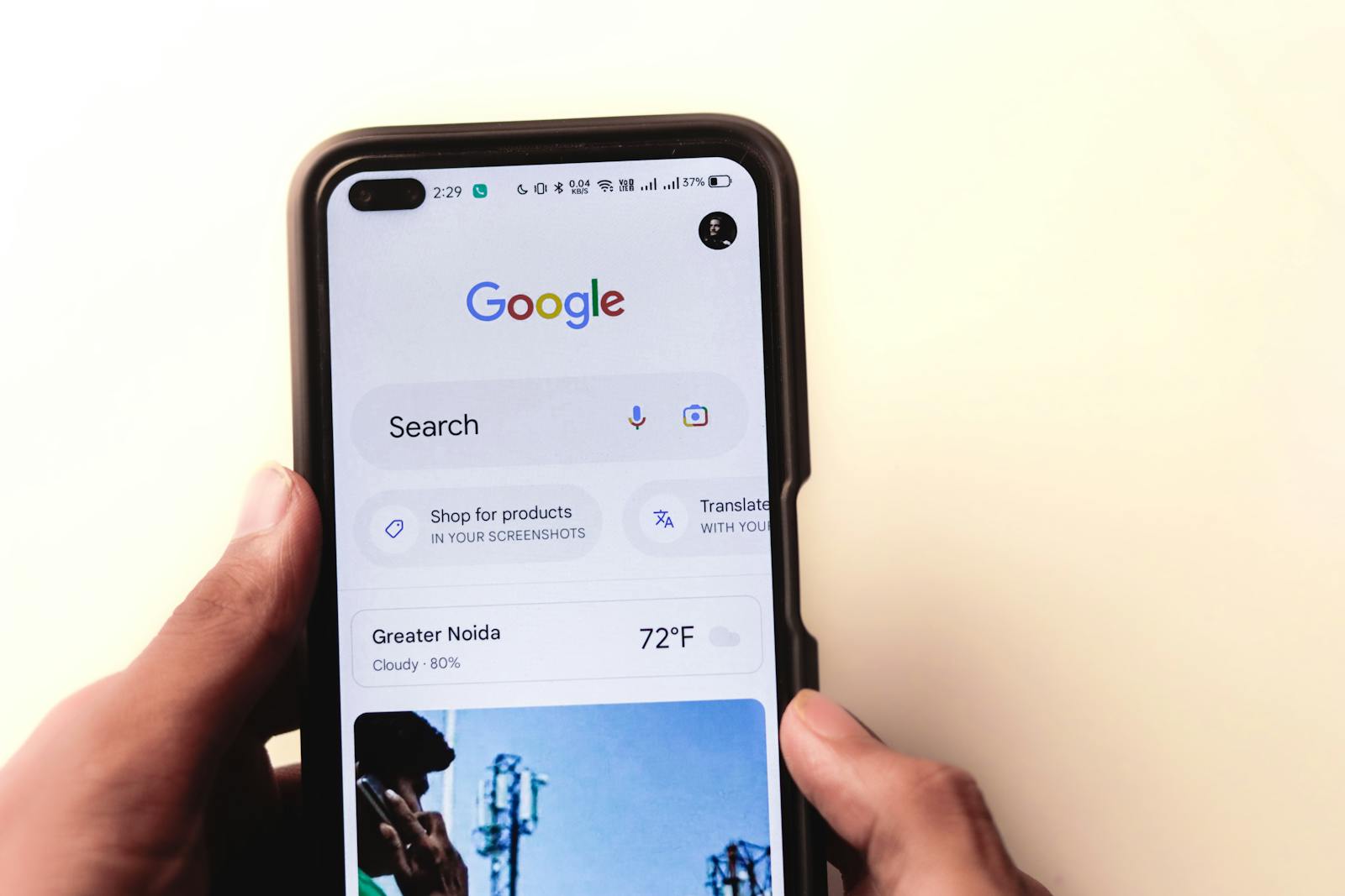 Prospective cosmetic surgery patient using a smartphone to research procedures on Google