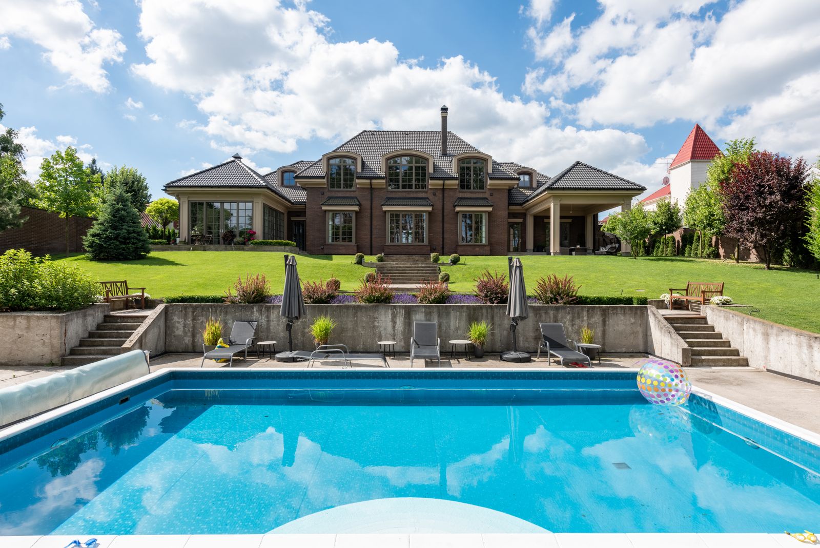 Luxury home with sparkling backyard pool at golden hour — the proof shots that fill Google Business Profiles