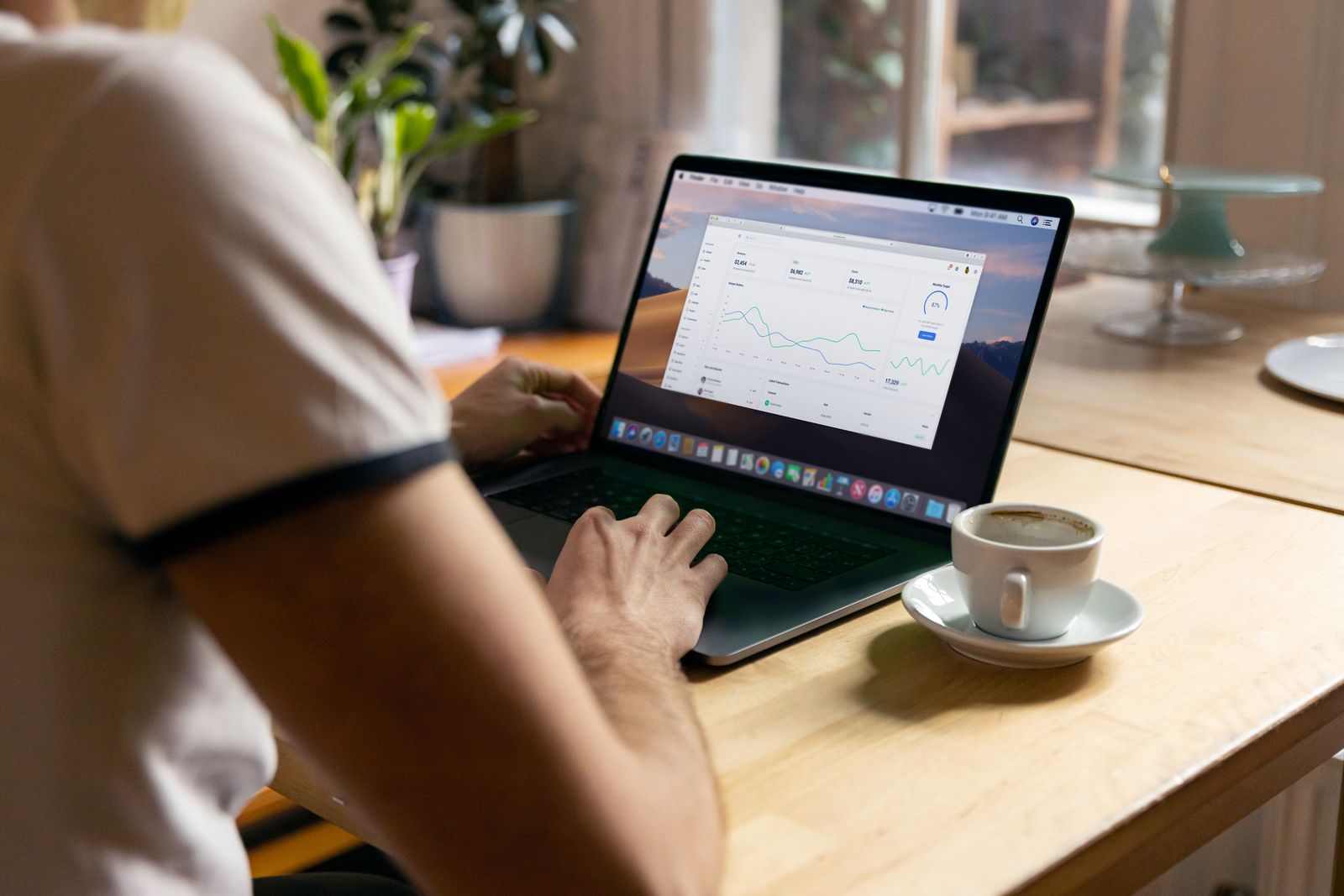 Contractor reviewing website traffic and lead analytics on a laptop