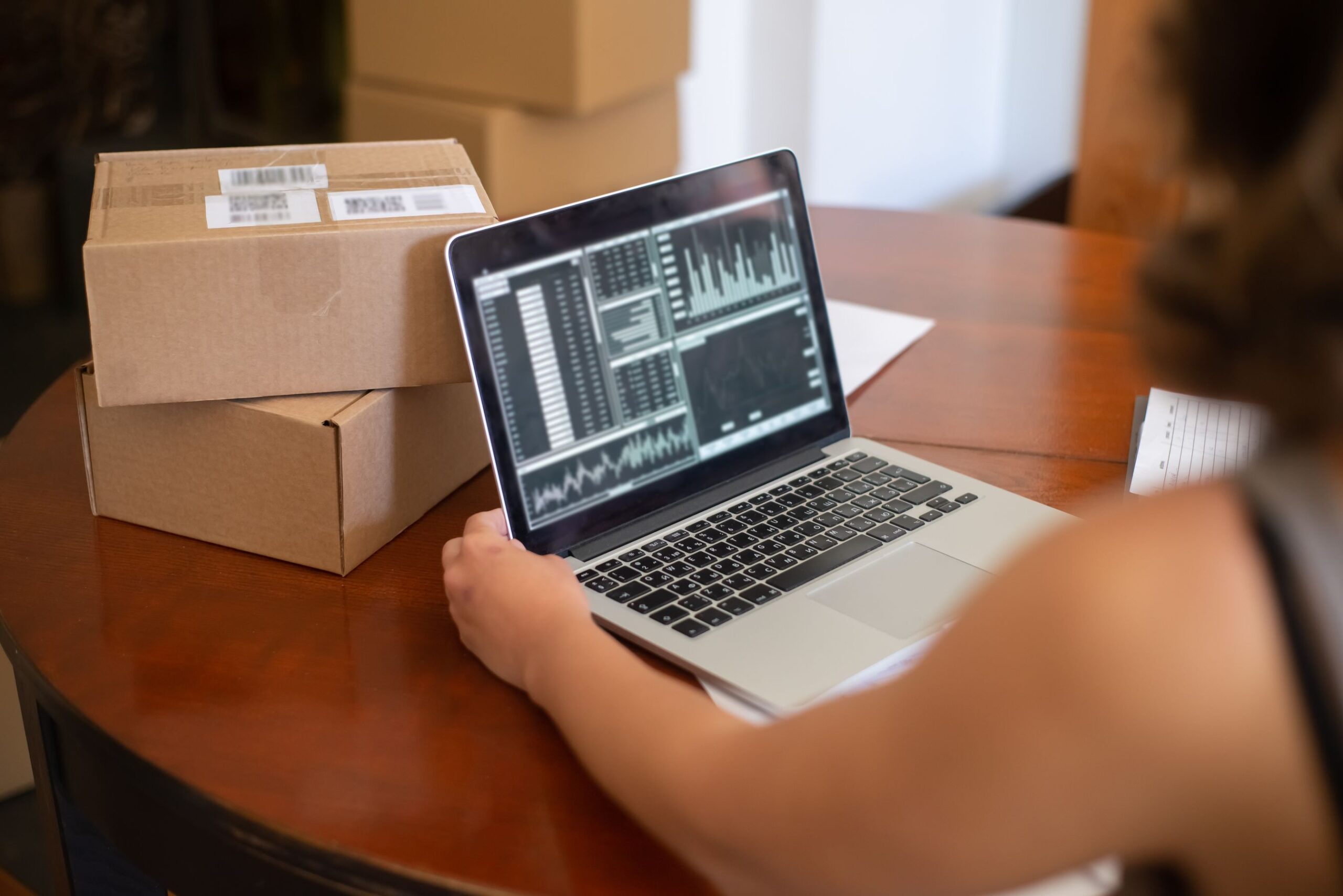 Contractor reviewing SEO traffic and lead data on a laptop at a home office desk