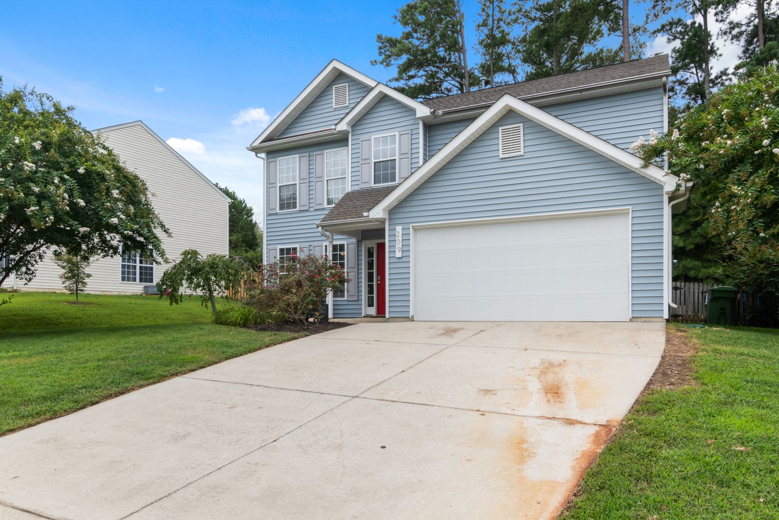 Suburban two-story house exterior — the kind of residential job painters compete for in local Google searches