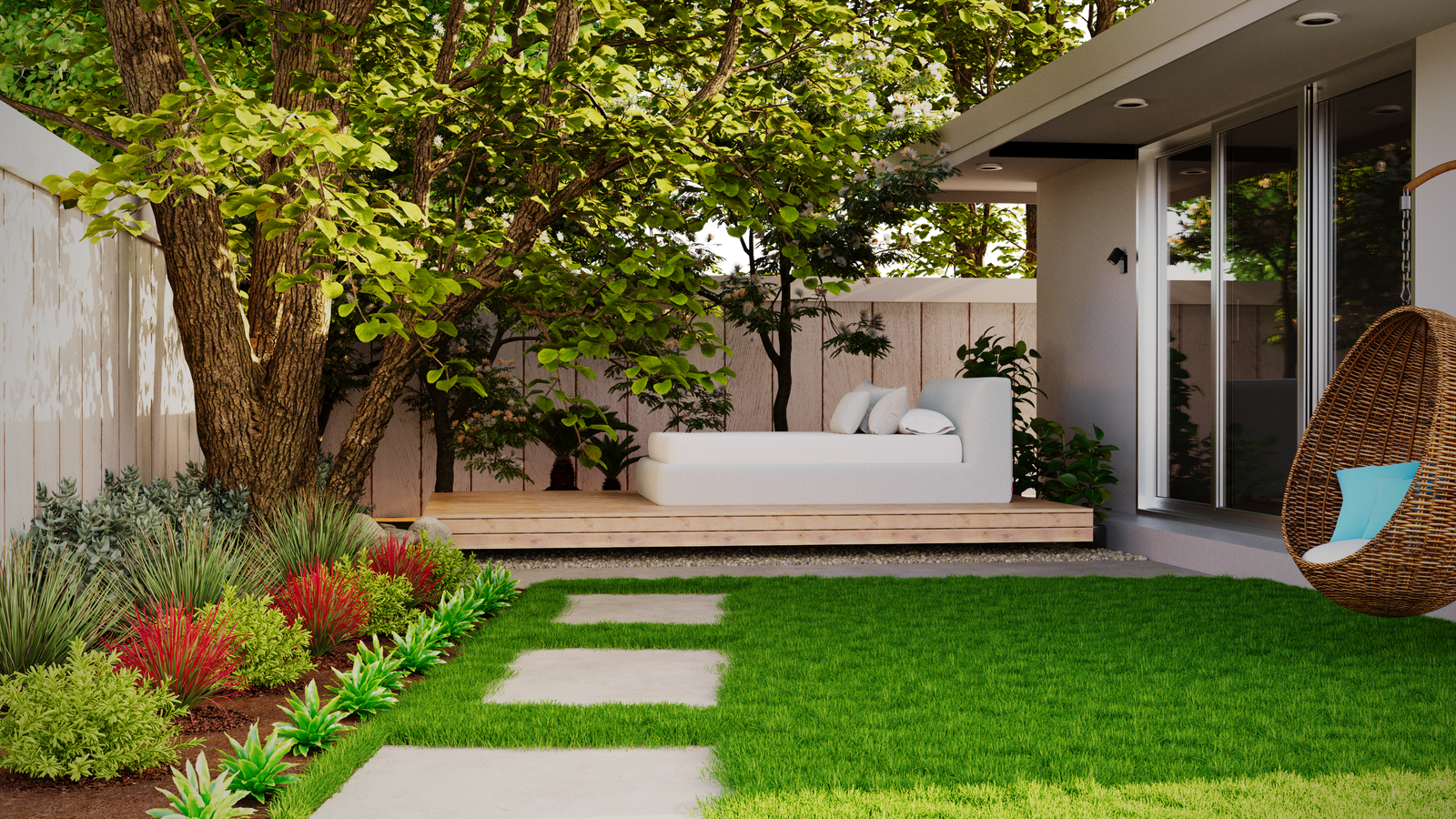 Newly designed backyard with a paver walkway, planting beds, and fresh lawn