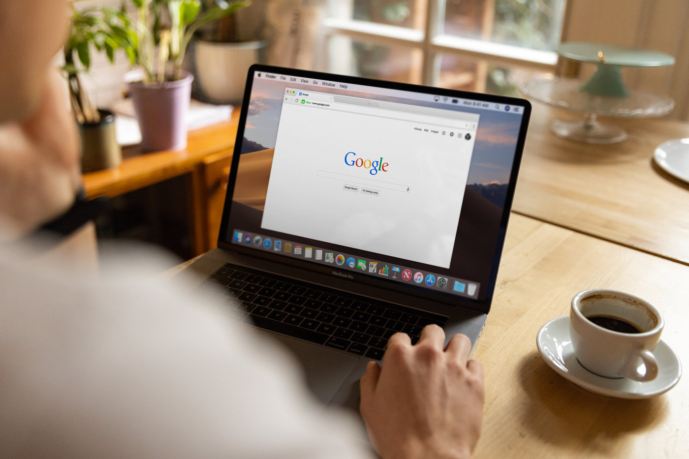 Homeowner searching Google on a laptop to find a local HVAC contractor