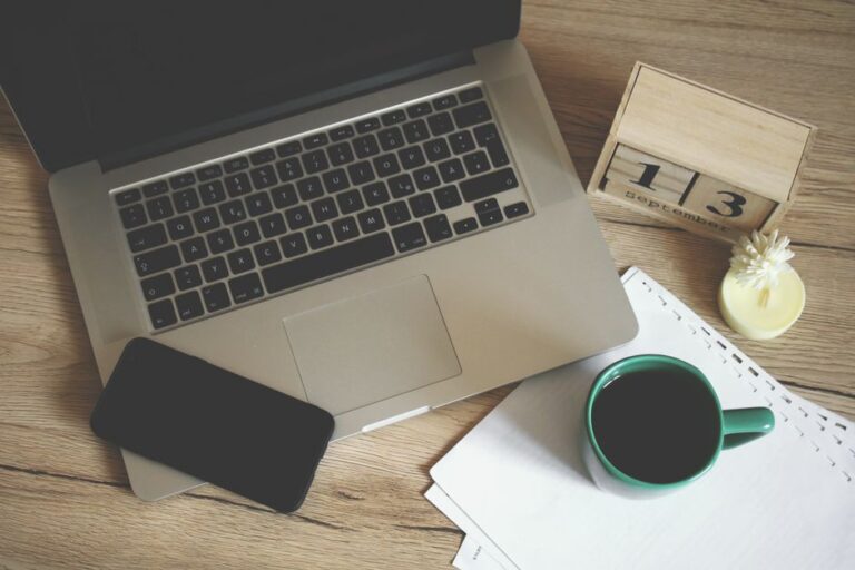 A small business owner's desk set up for planning a weekly content schedule