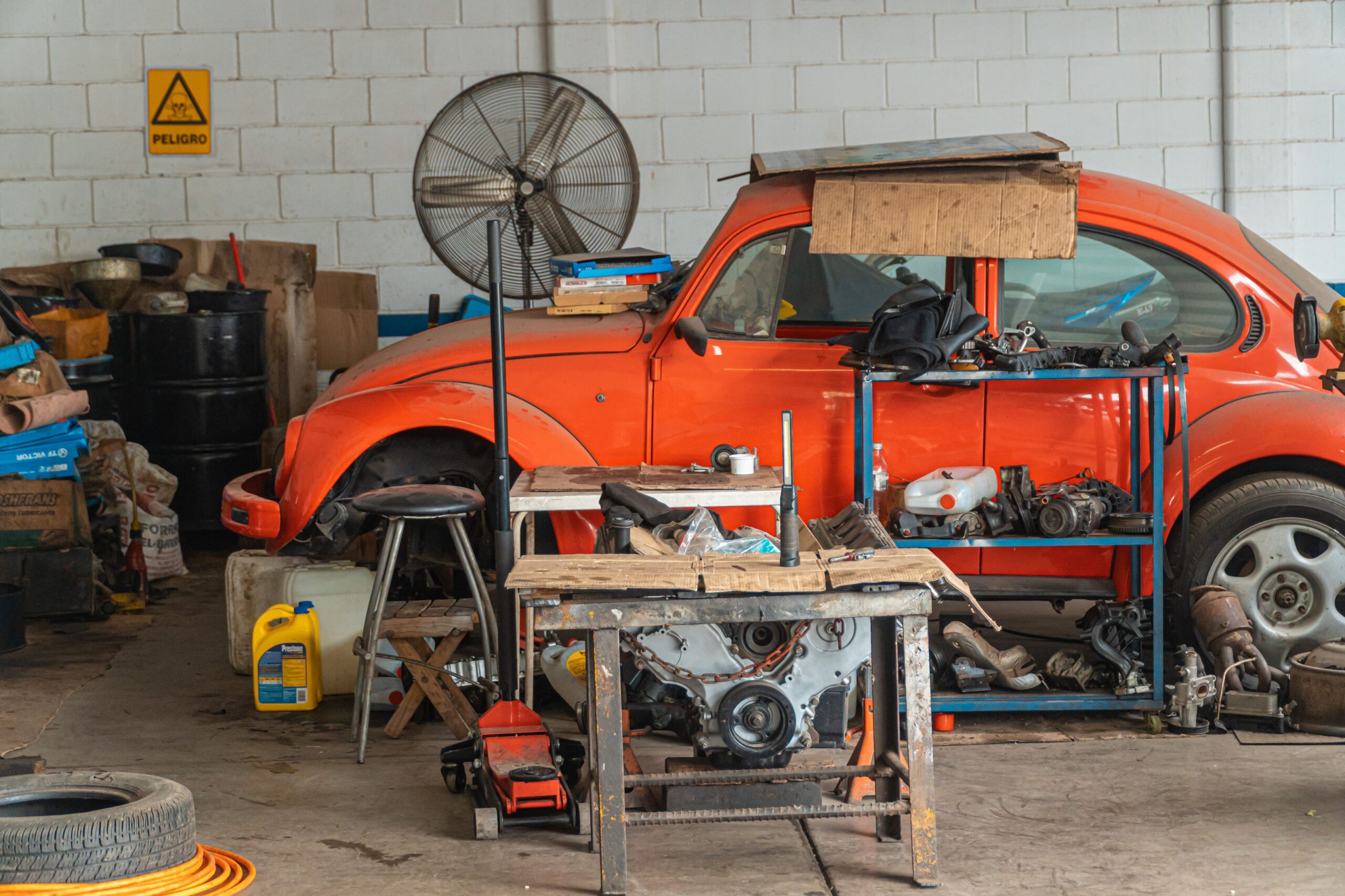 A cluttered garage full of old items waiting to be hauled away