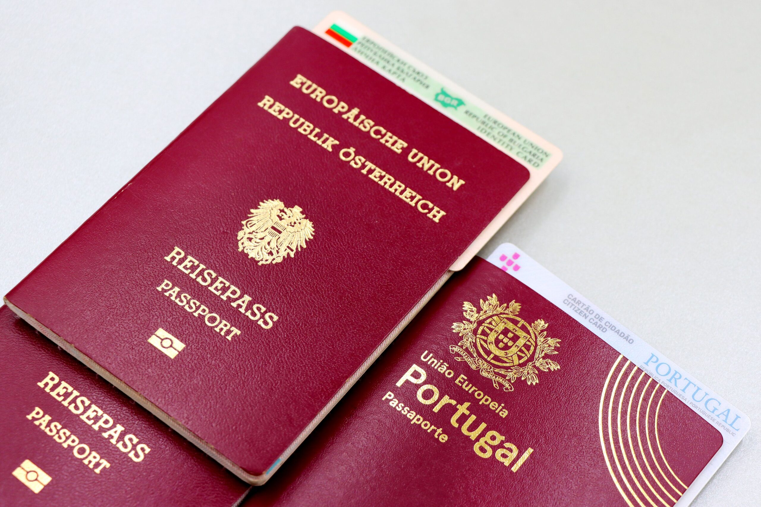 Passports and travel documents on a table representing immigration cases