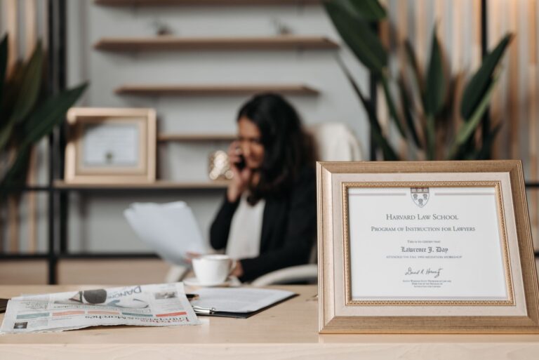 Personal injury law office with framed law school certificate on the desk