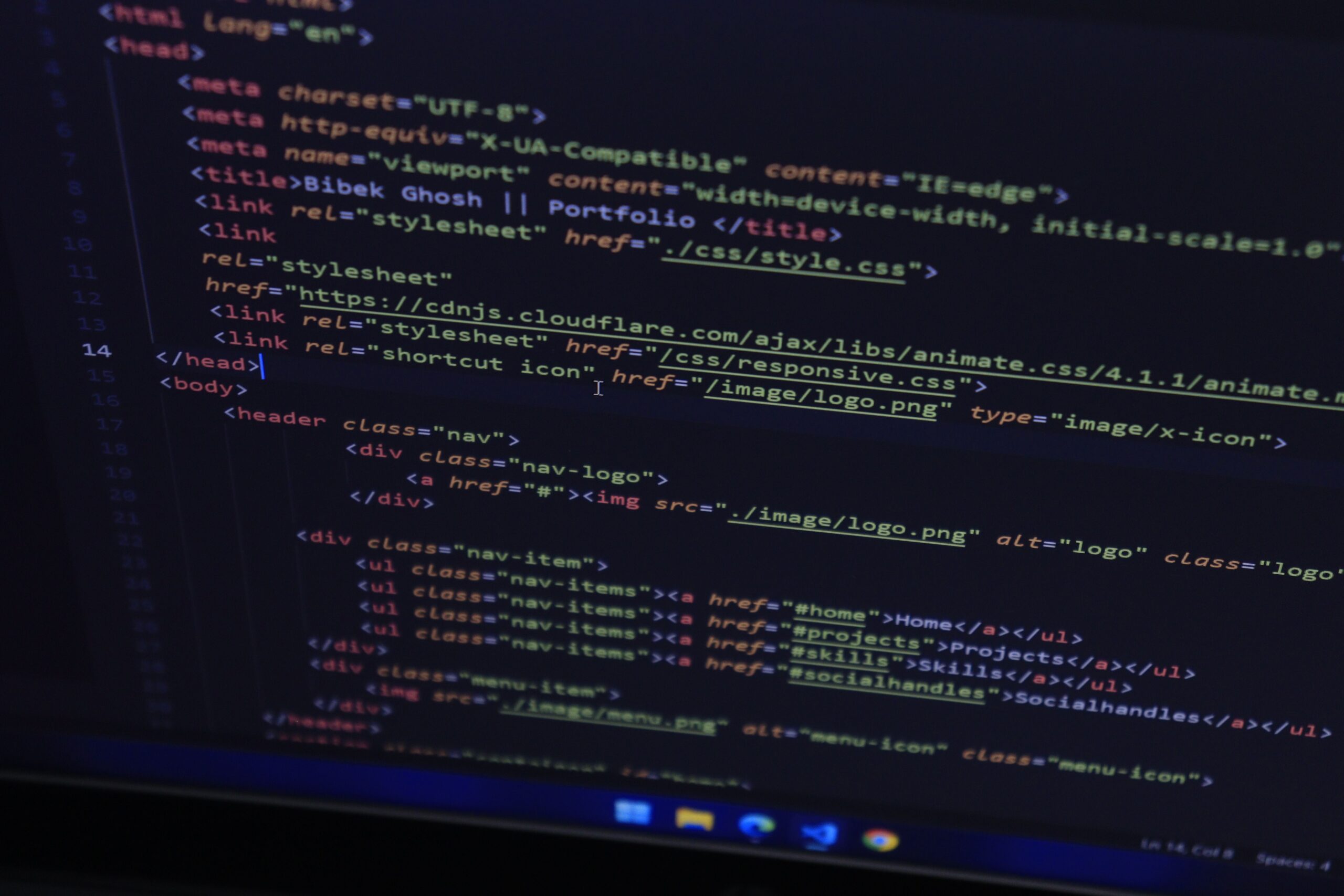 HTML code displayed on a dark monitor screen — representing Core Web Vitals and website technical optimization