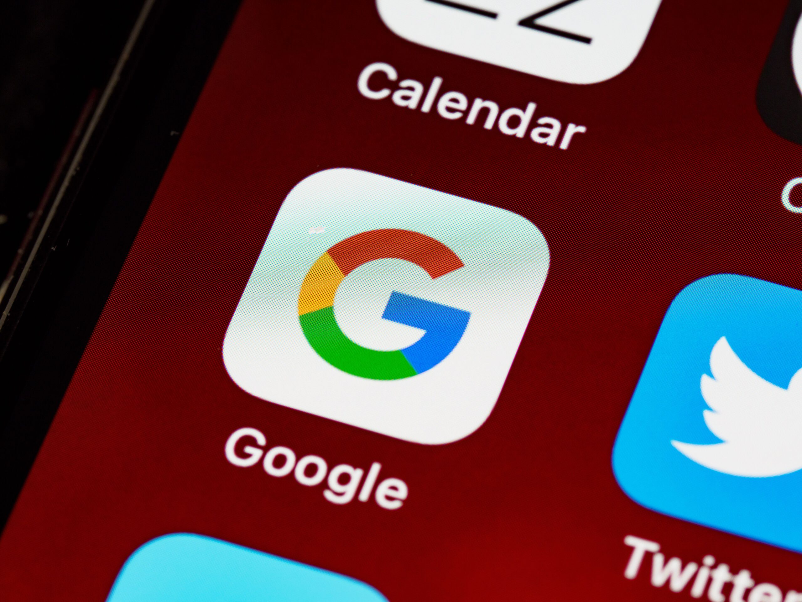 Close-up of Google app icon on a smartphone screen — representing local Google search for small businesses