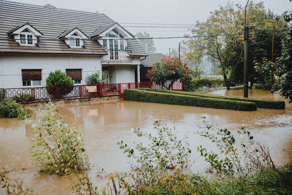 A flooded suburban home after a storm — exactly the kind of emergency search restoration companies want to own on Google