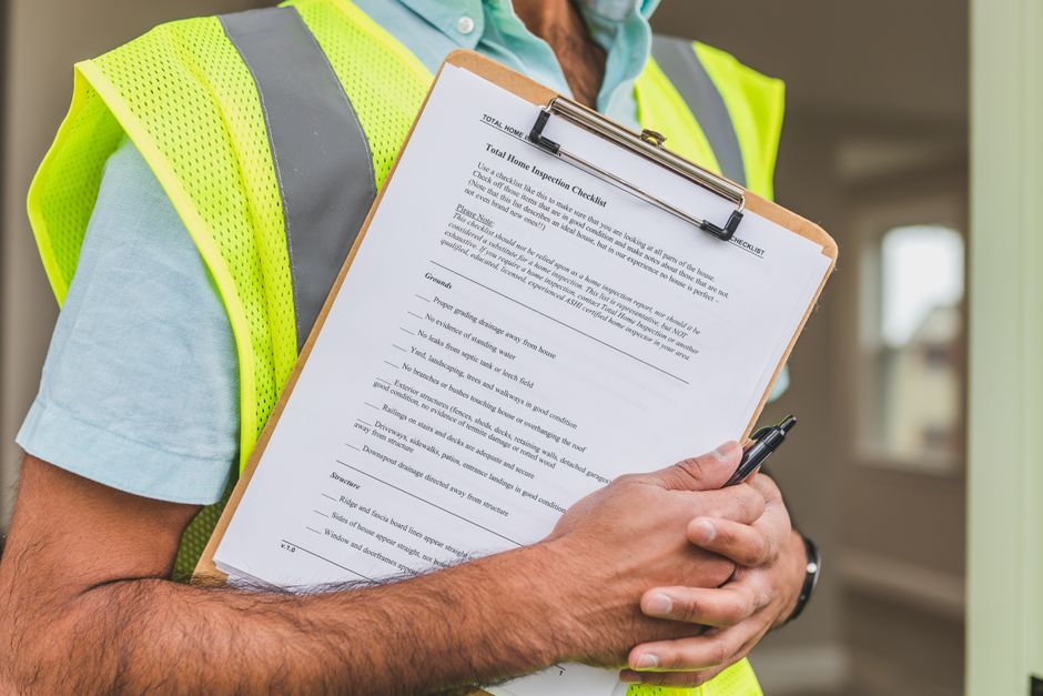 A technician documenting damage details for an insurance claim