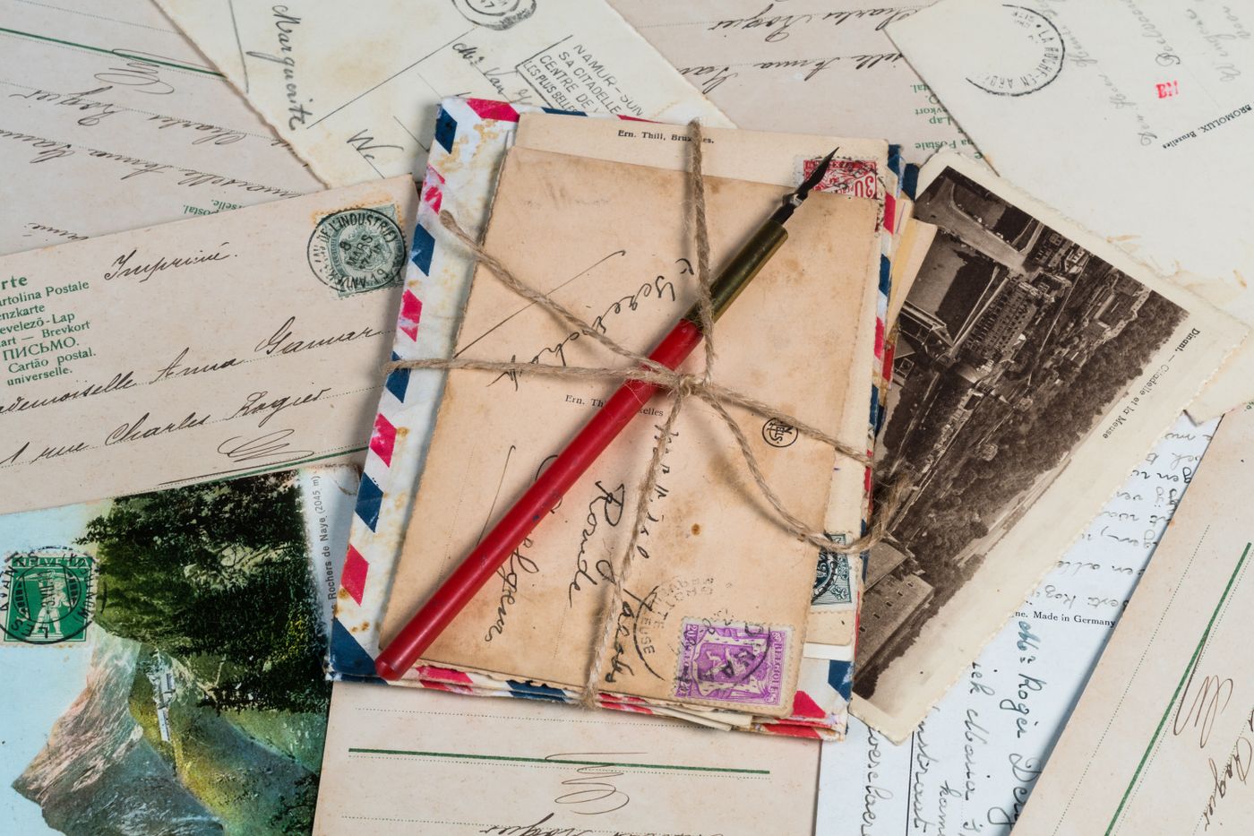 Stack of vintage direct mail letters and postcards representing traditional marketing