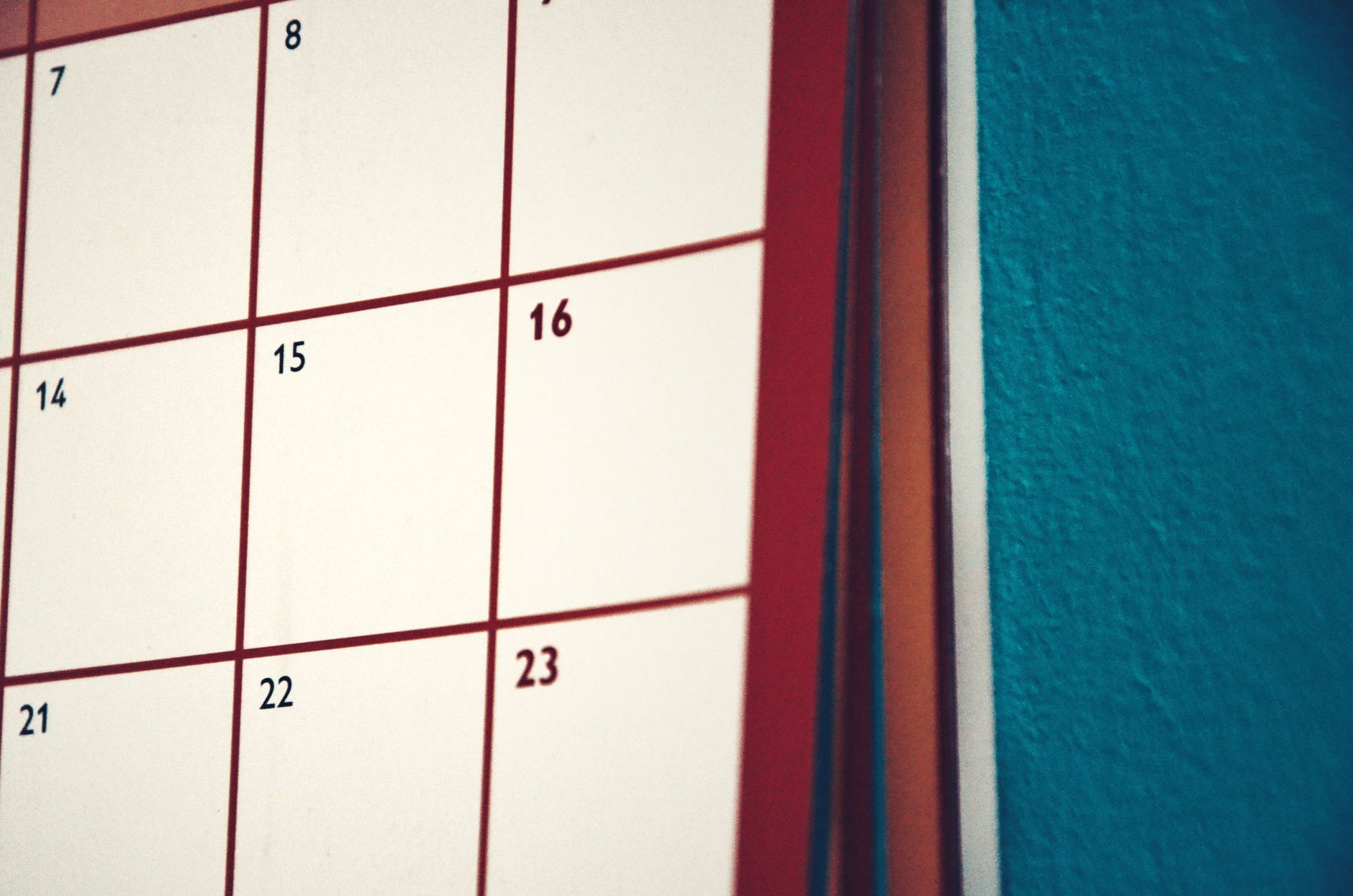 A wall calendar marking a consistent monthly blog publishing schedule