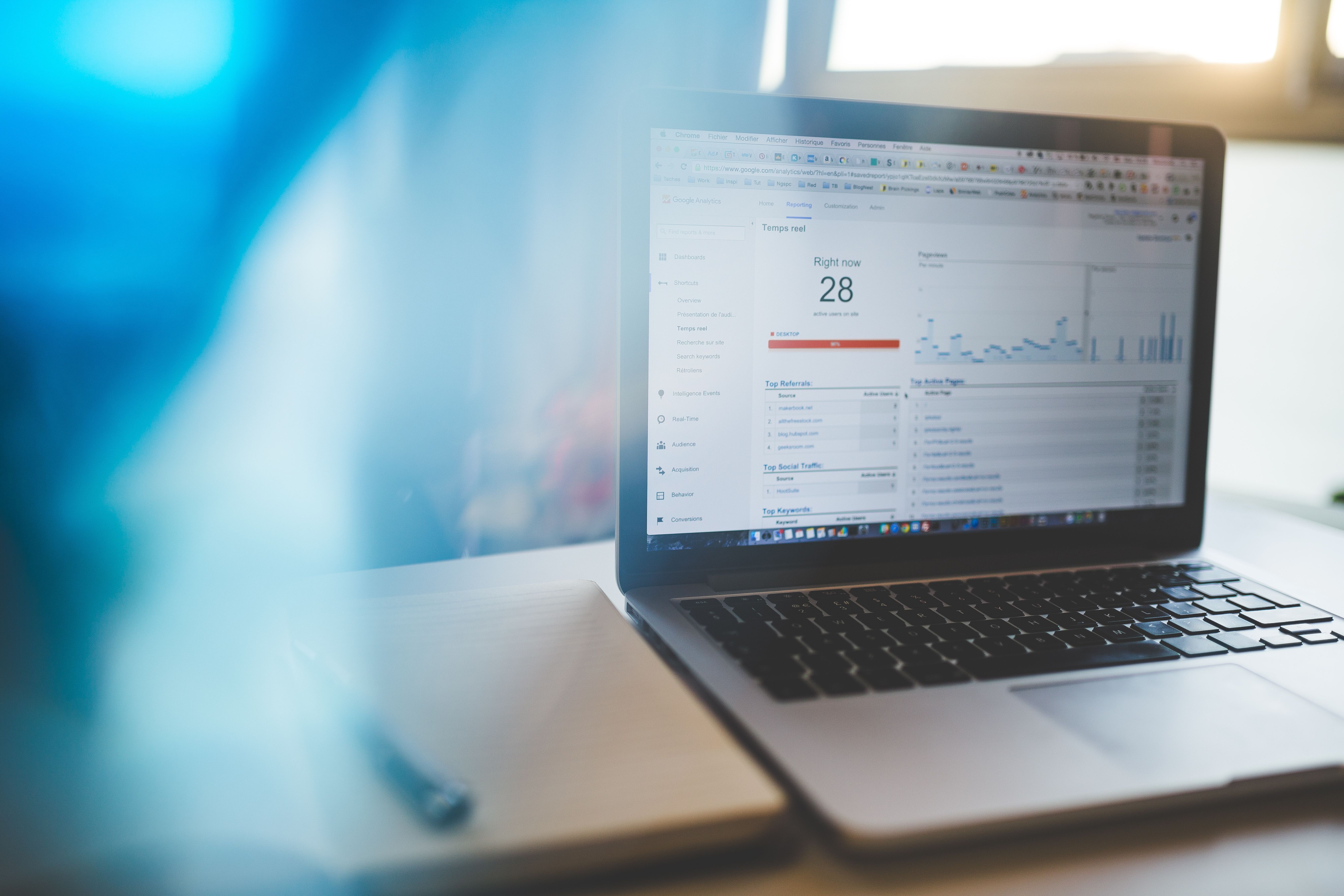Laptop showing an SEO analytics dashboard with website traffic growth charts