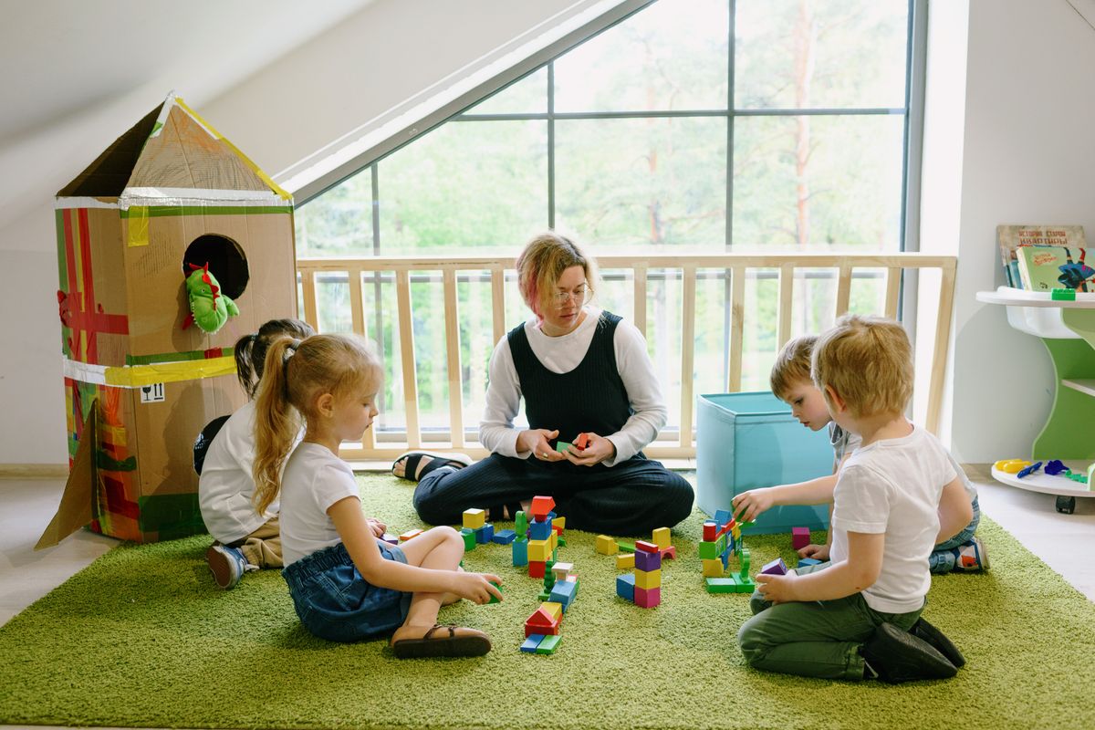 Children playing and learning together in a bright daycare environment