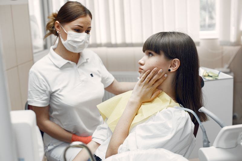 Dentist performing a routine dental checkup
