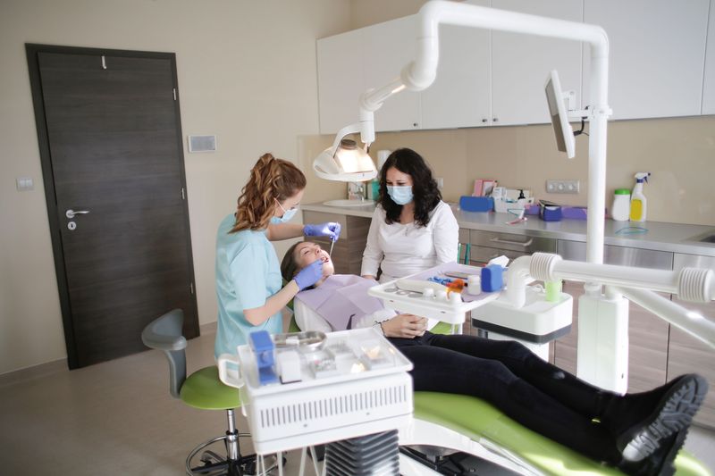 Dental tools and equipment laid out for a procedure