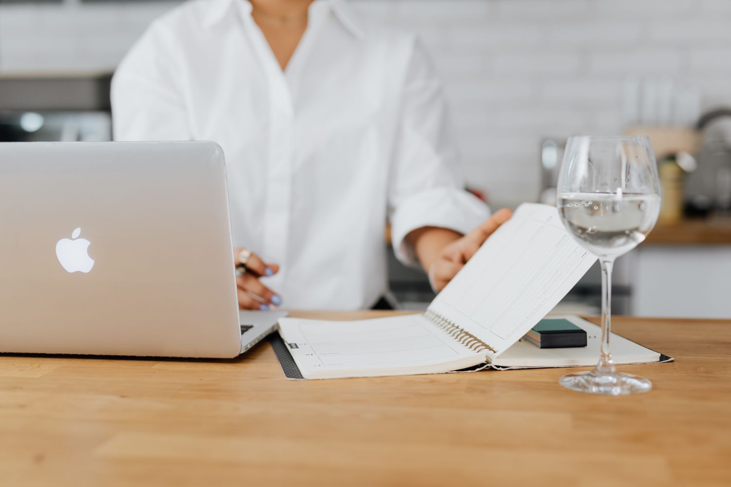 A business owner planning a content calendar and appointment schedule on a laptop