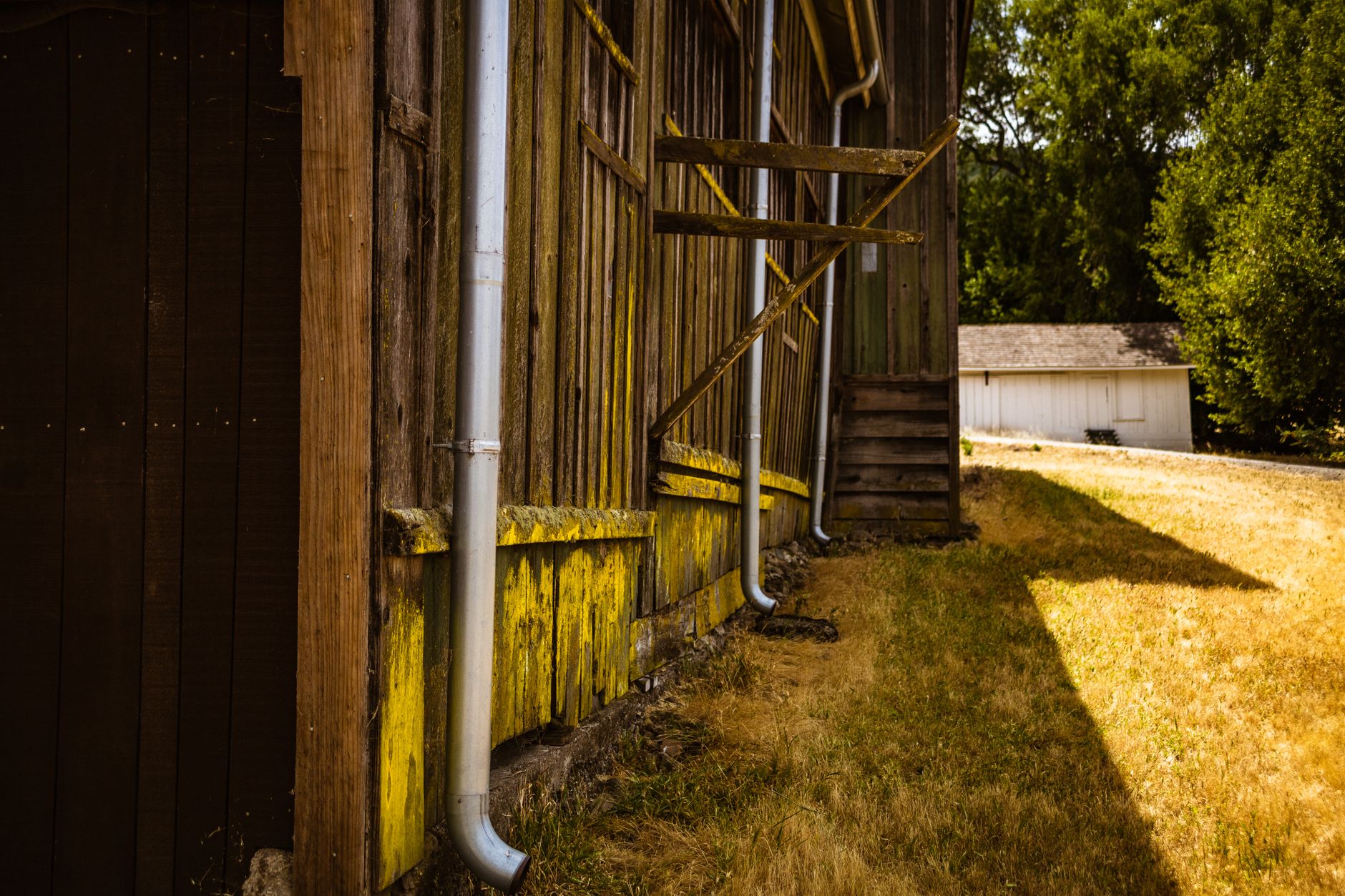 Rain gutters running along the roofline of a house on a sunny day