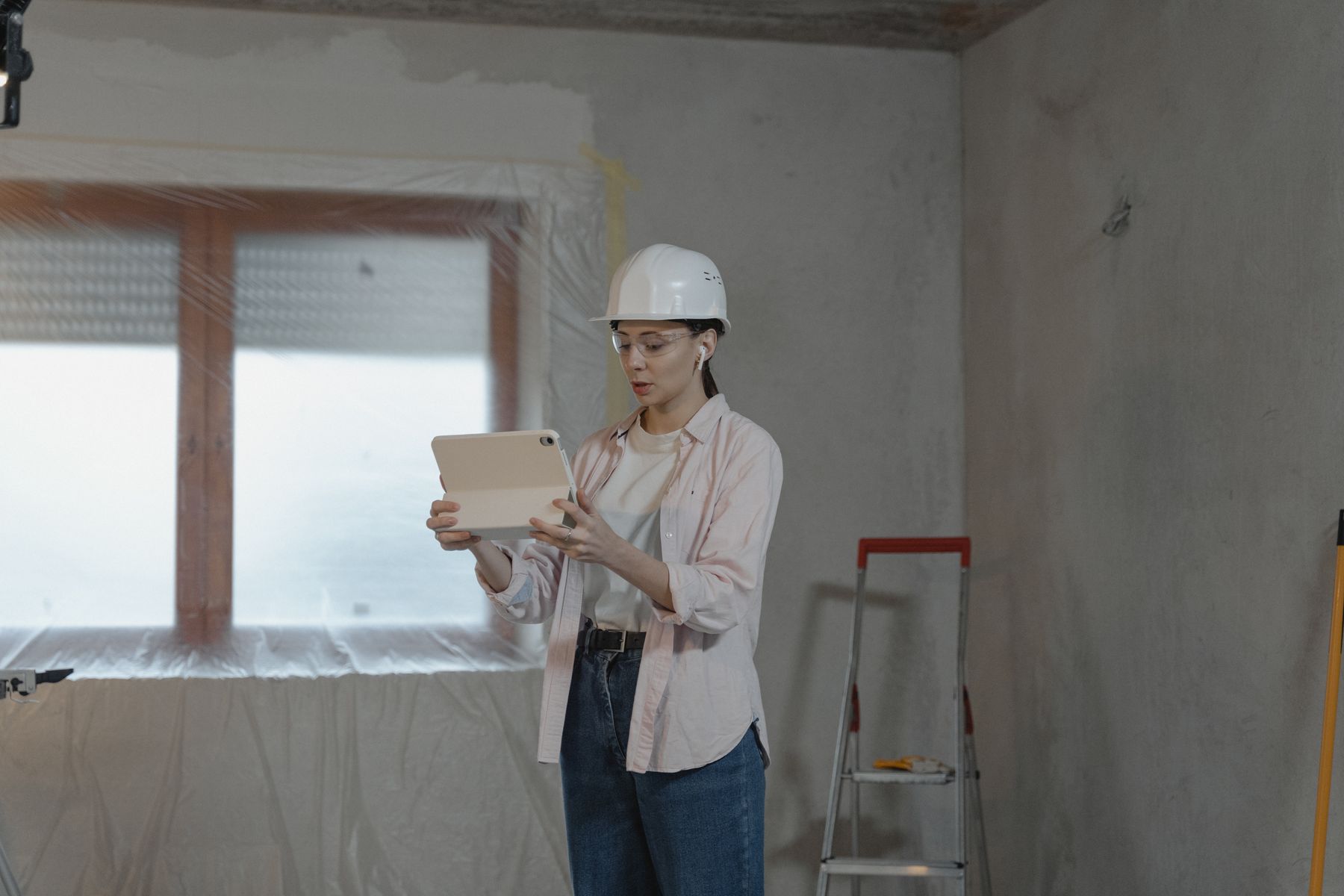 Contractor comparing SEO vs Angi leads while planning blog content on a laptop