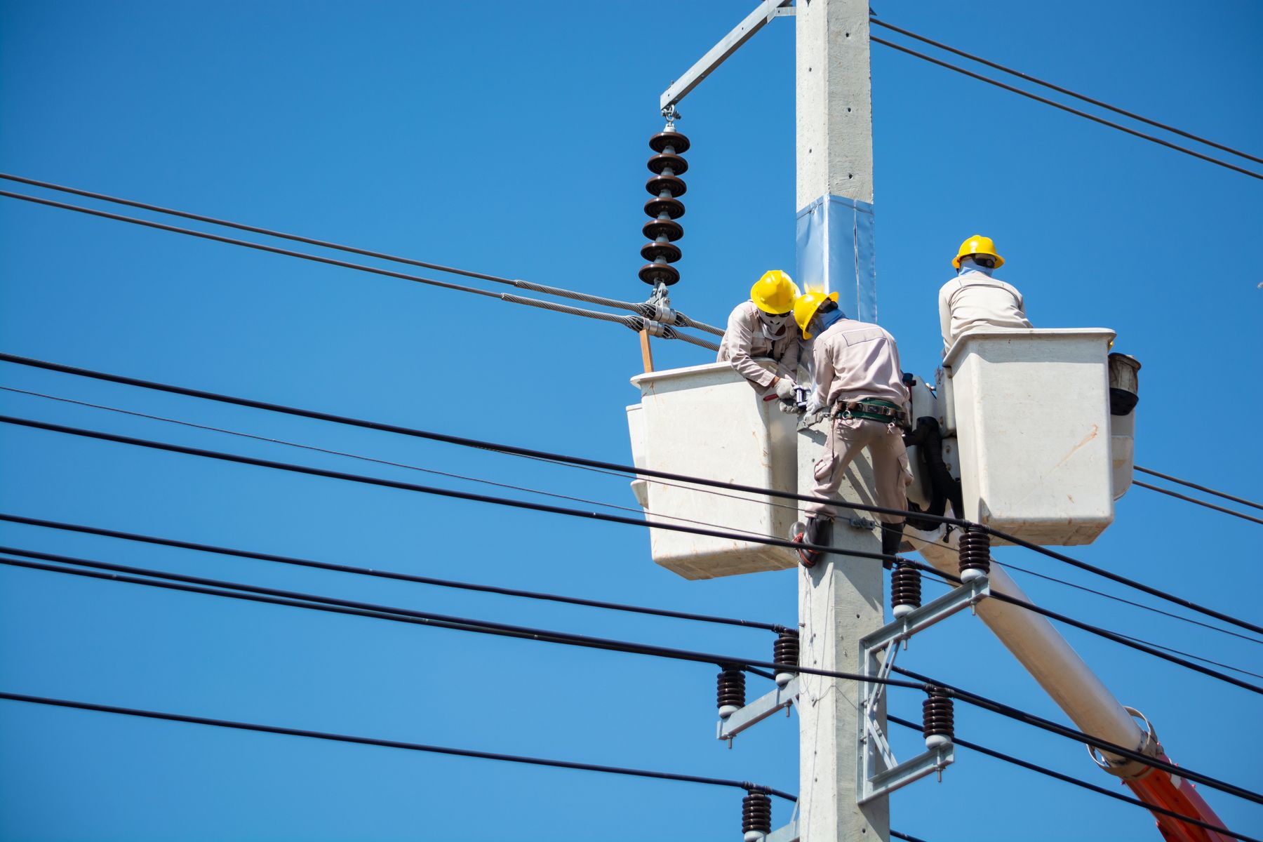 Electrician working from a service truck reviewing job details