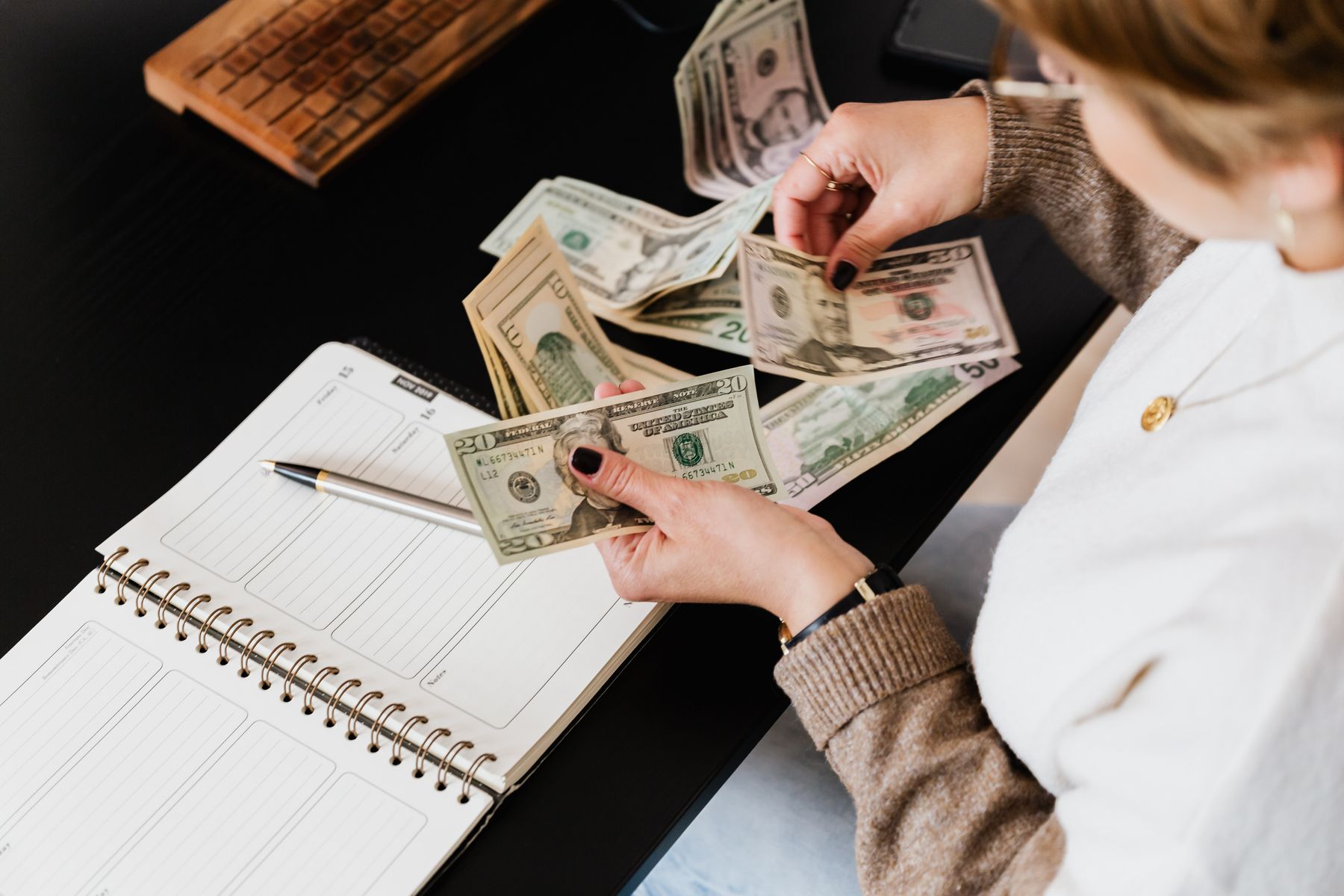 Business owner reviewing marketing budget and expenses at a desk