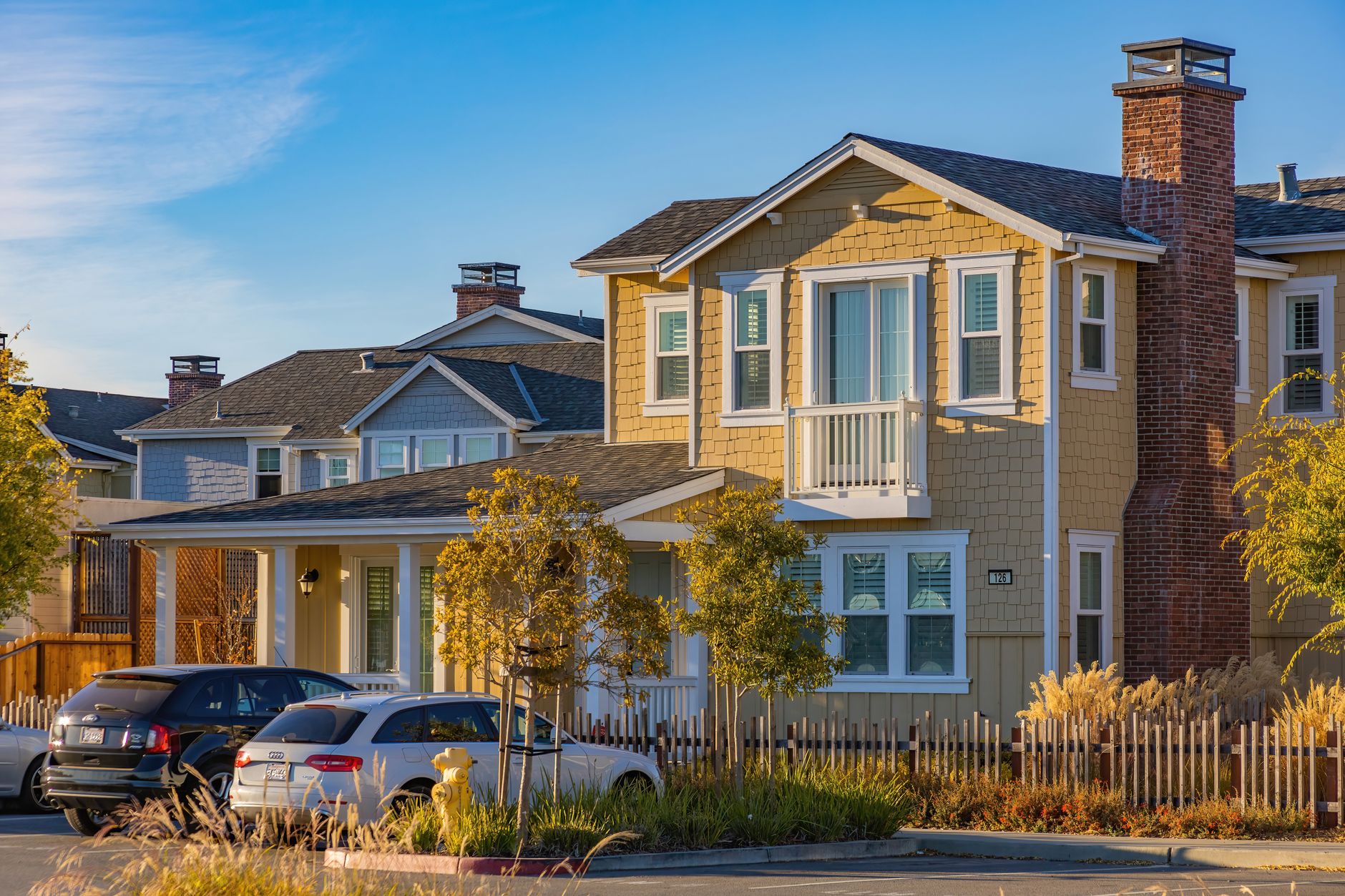 quiet tree-lined residential street in a suburban neighborhood