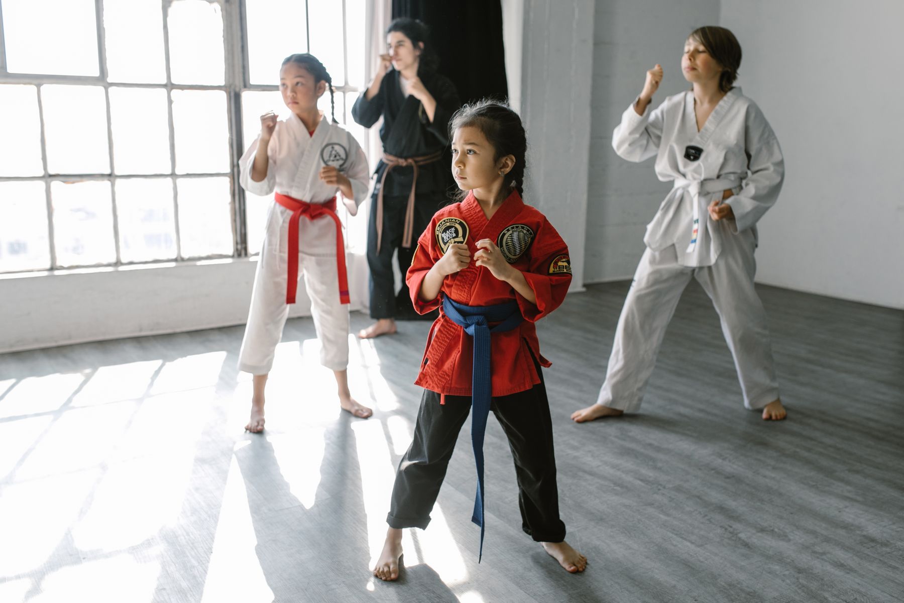 Kids practicing techniques during a martial arts class