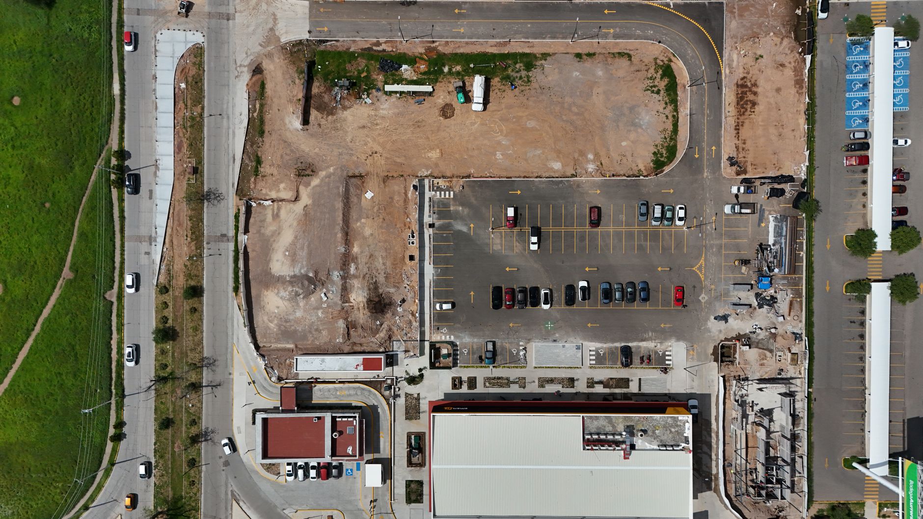 Freshly paved commercial parking lot under construction