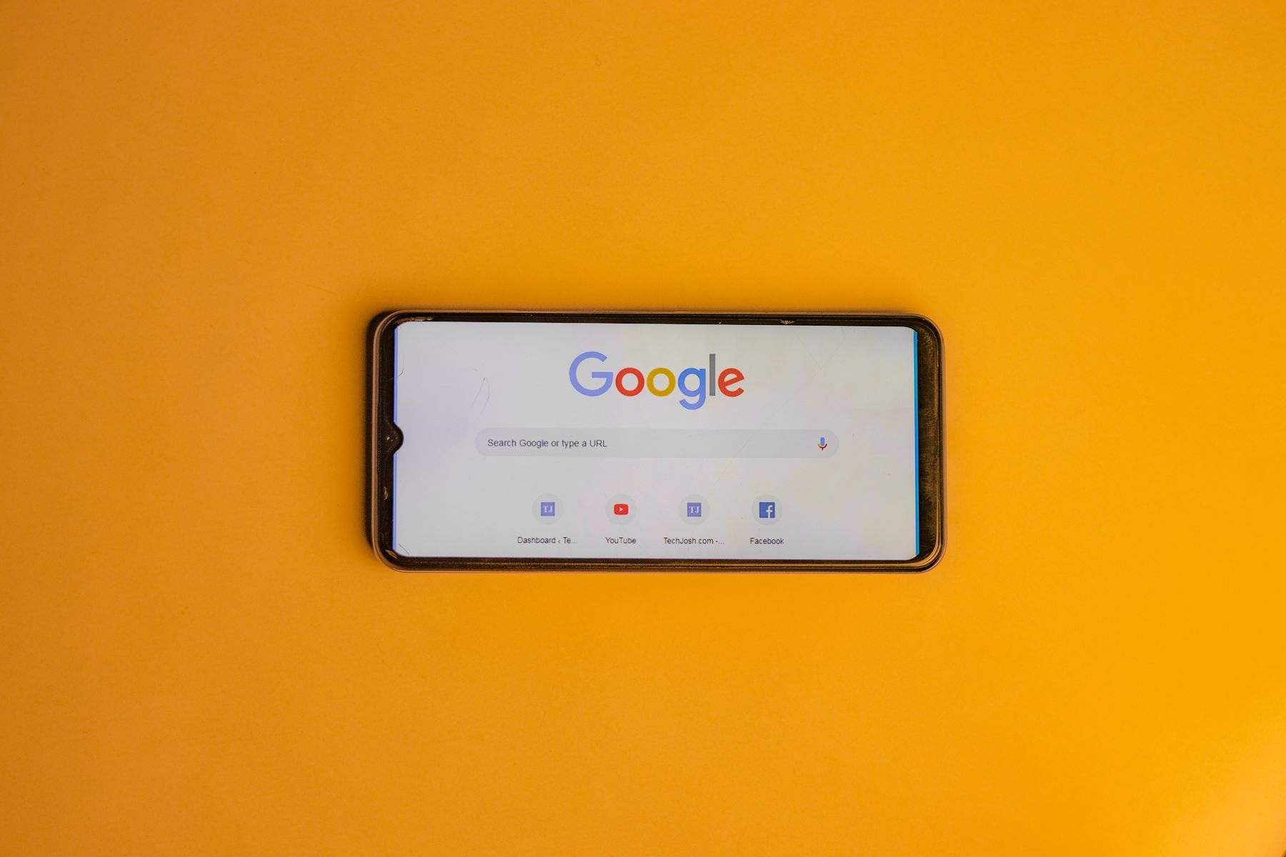 Smartphone screen showing a Google search, representing how homeowners research foundation problems before calling a contractor
