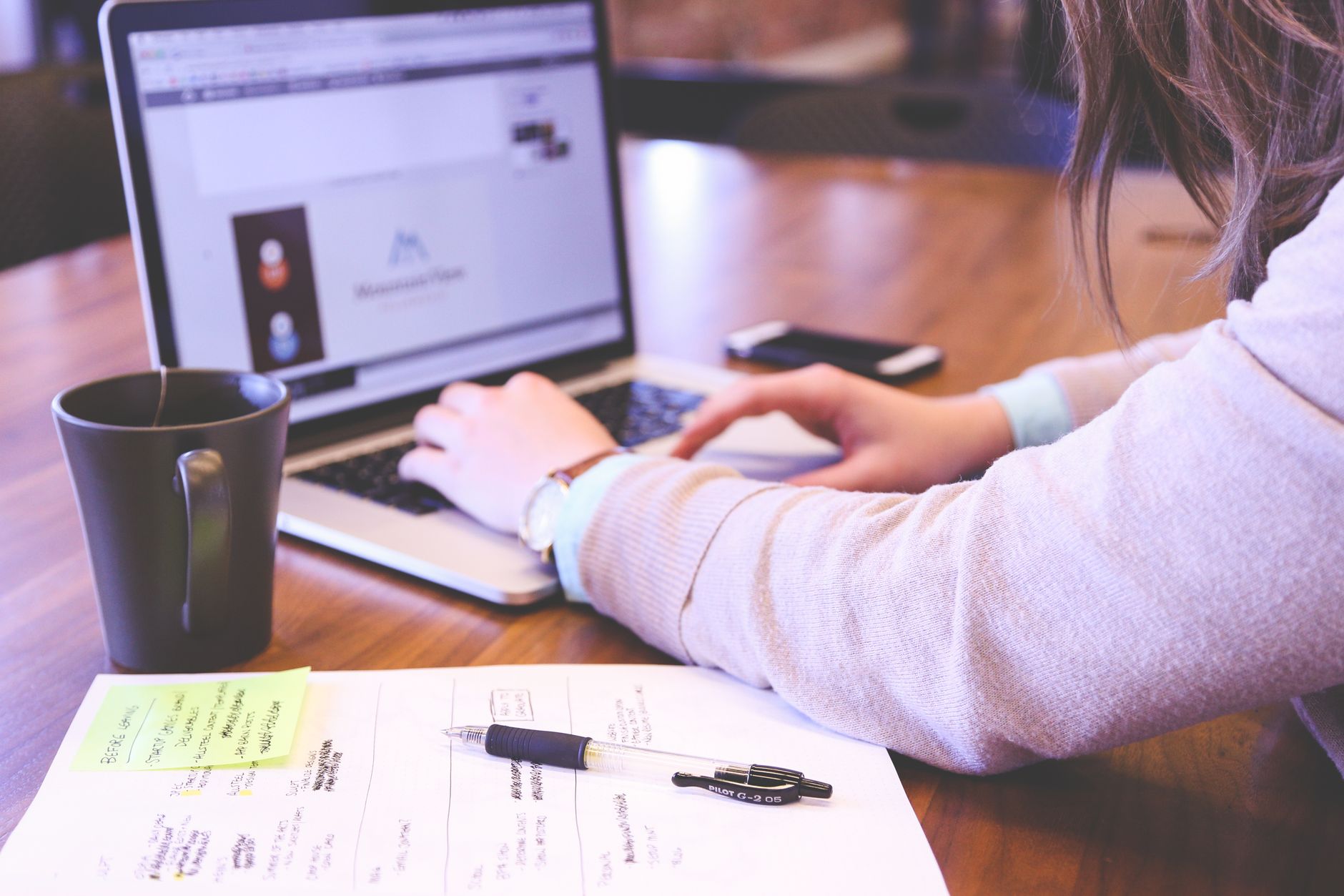 Small business owner reviewing website analytics on a laptop