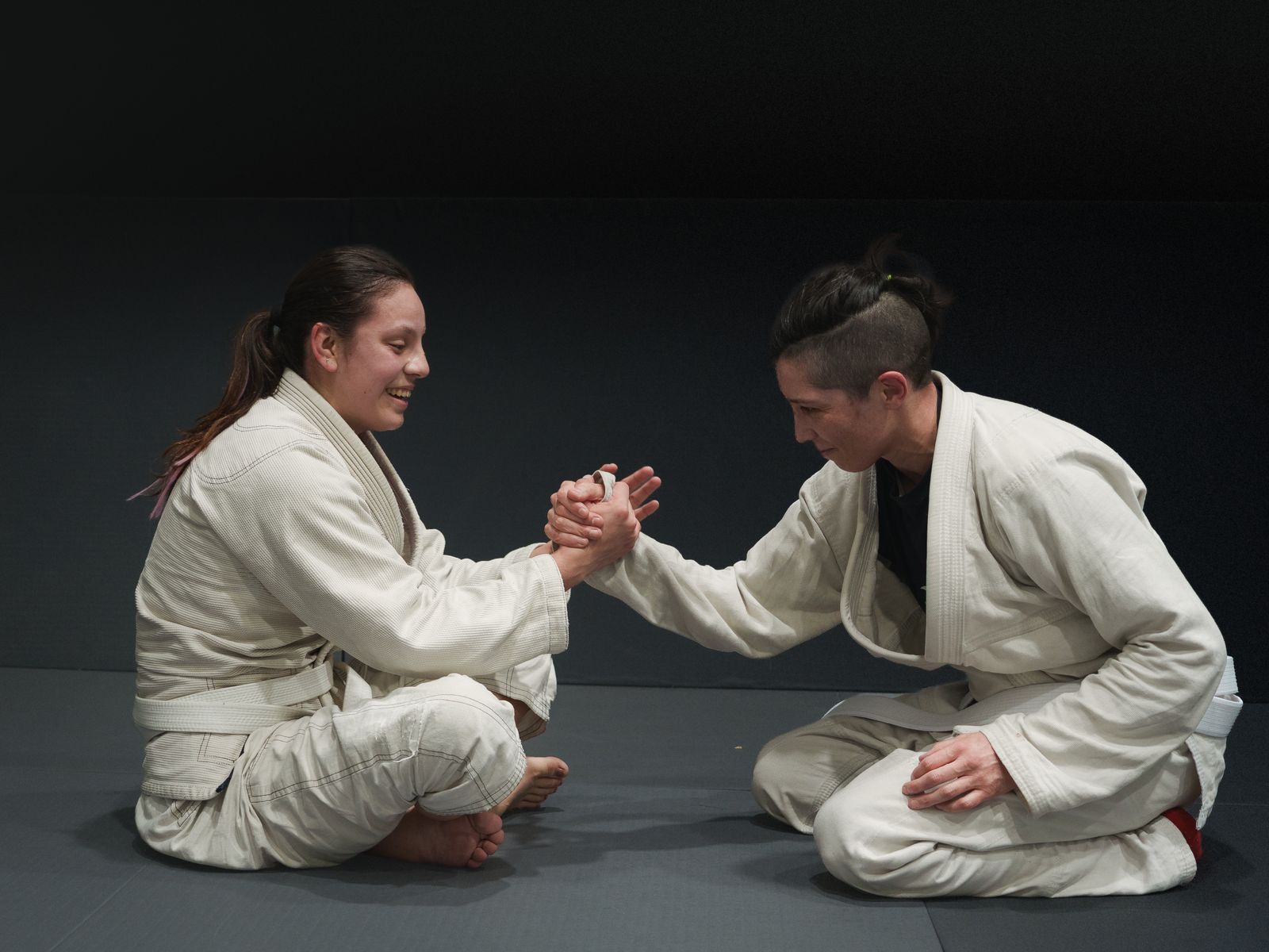 Martial arts students training together in a gym