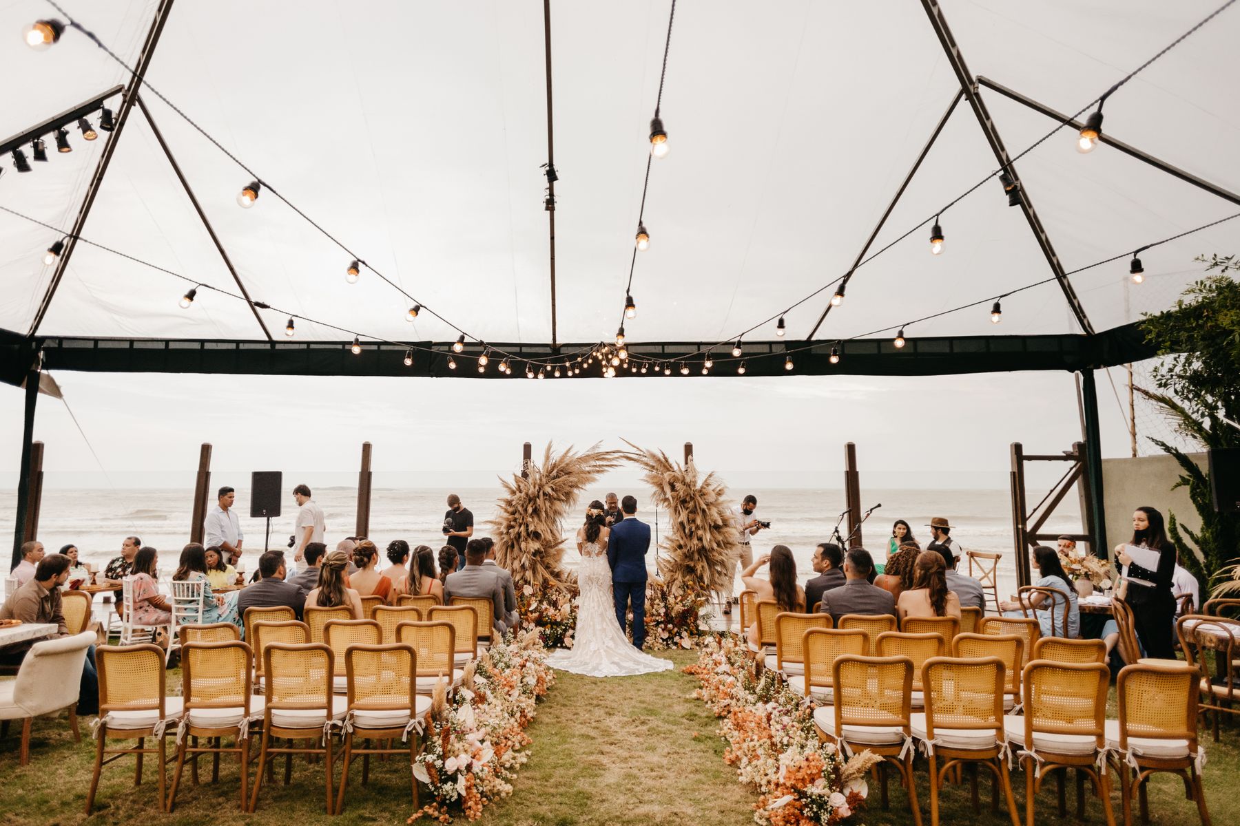 Wedding ceremony setup at an outdoor venue with guest chairs