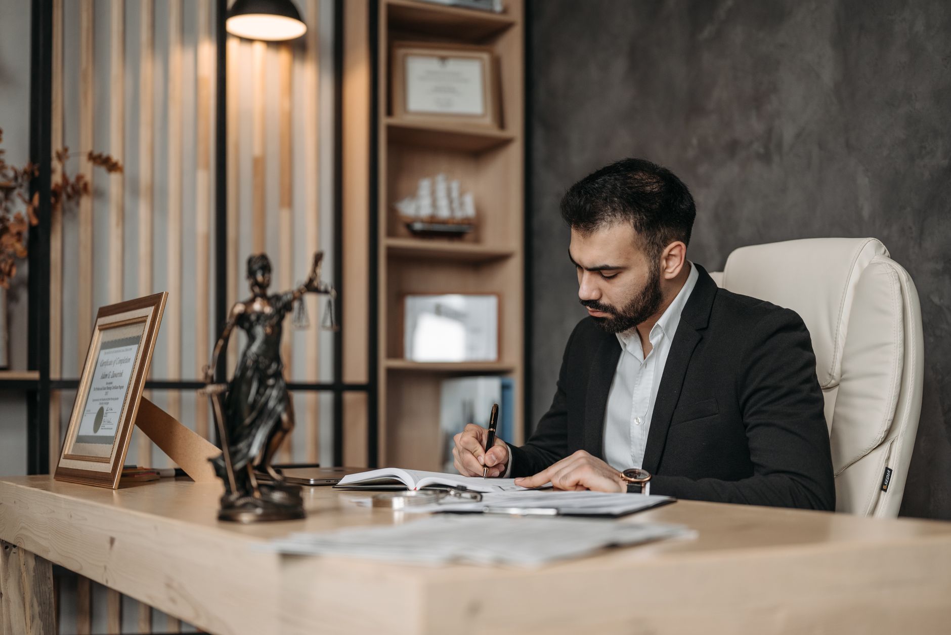 Attorney reviewing a draft blog post at a law office desk before it goes live