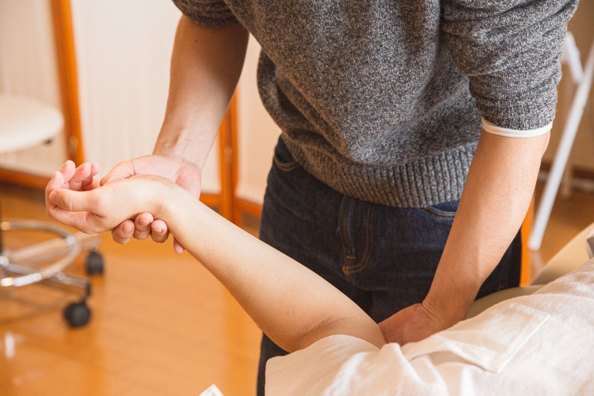 Rehabilitation therapy session with a patient and physical therapist