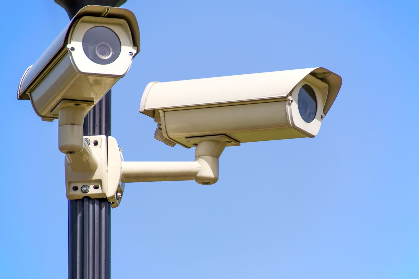 Outdoor security cameras mounted on a pole for property surveillance