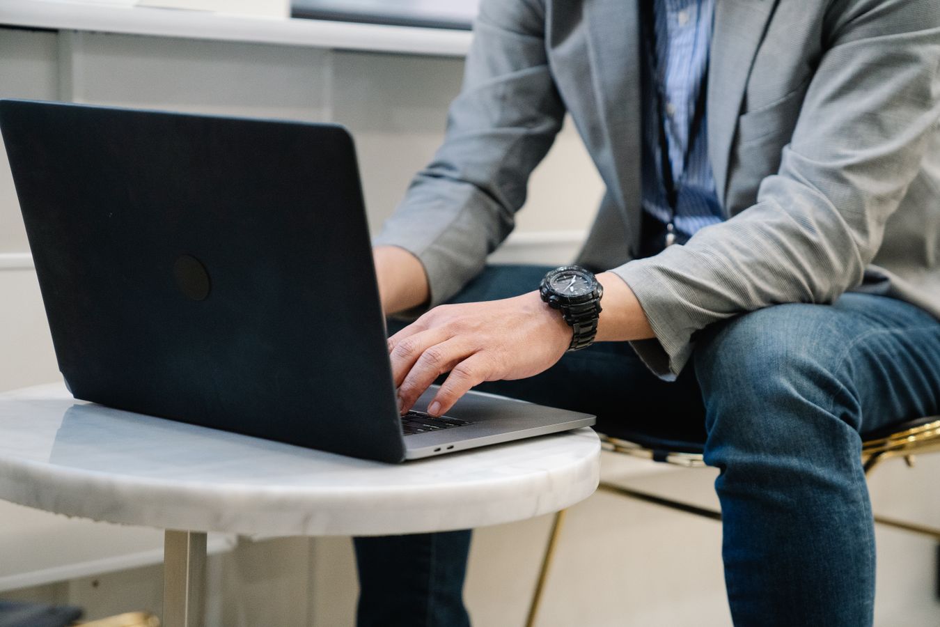 Business owner reviewing search rankings and customer inquiries on a laptop