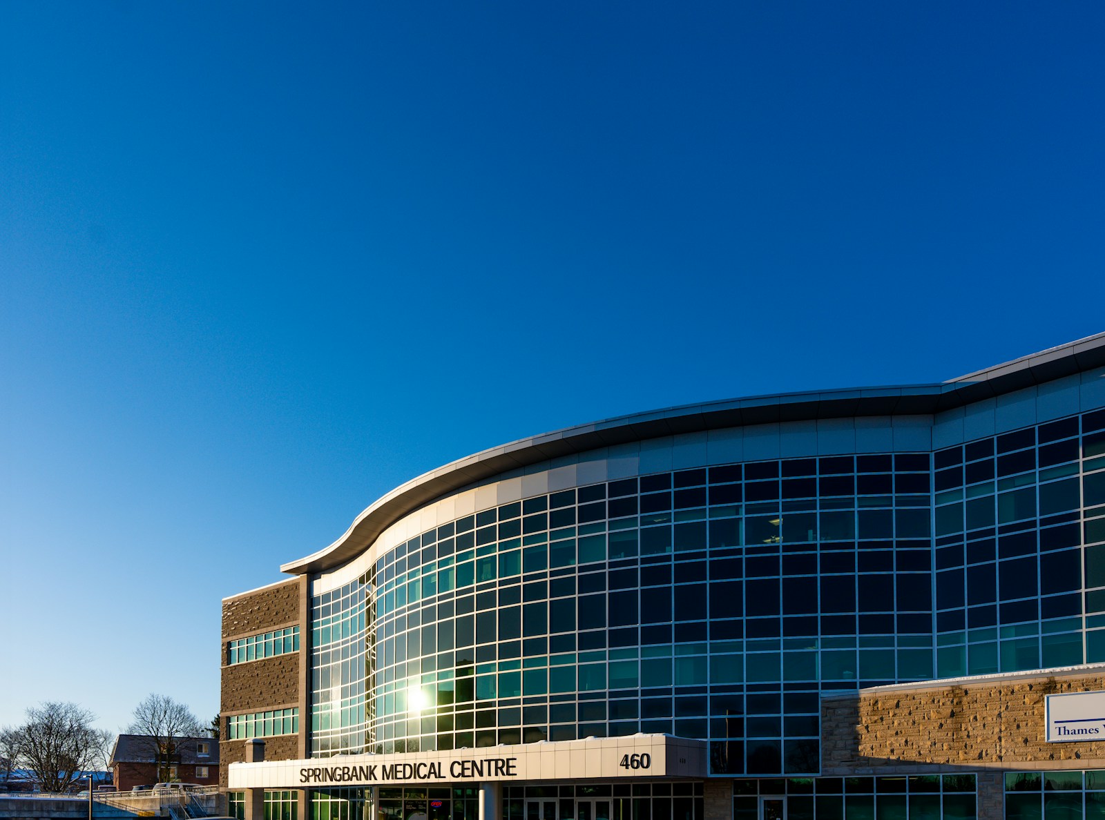 Modern glass-fronted medical office building representing an allergy and immunology practice location