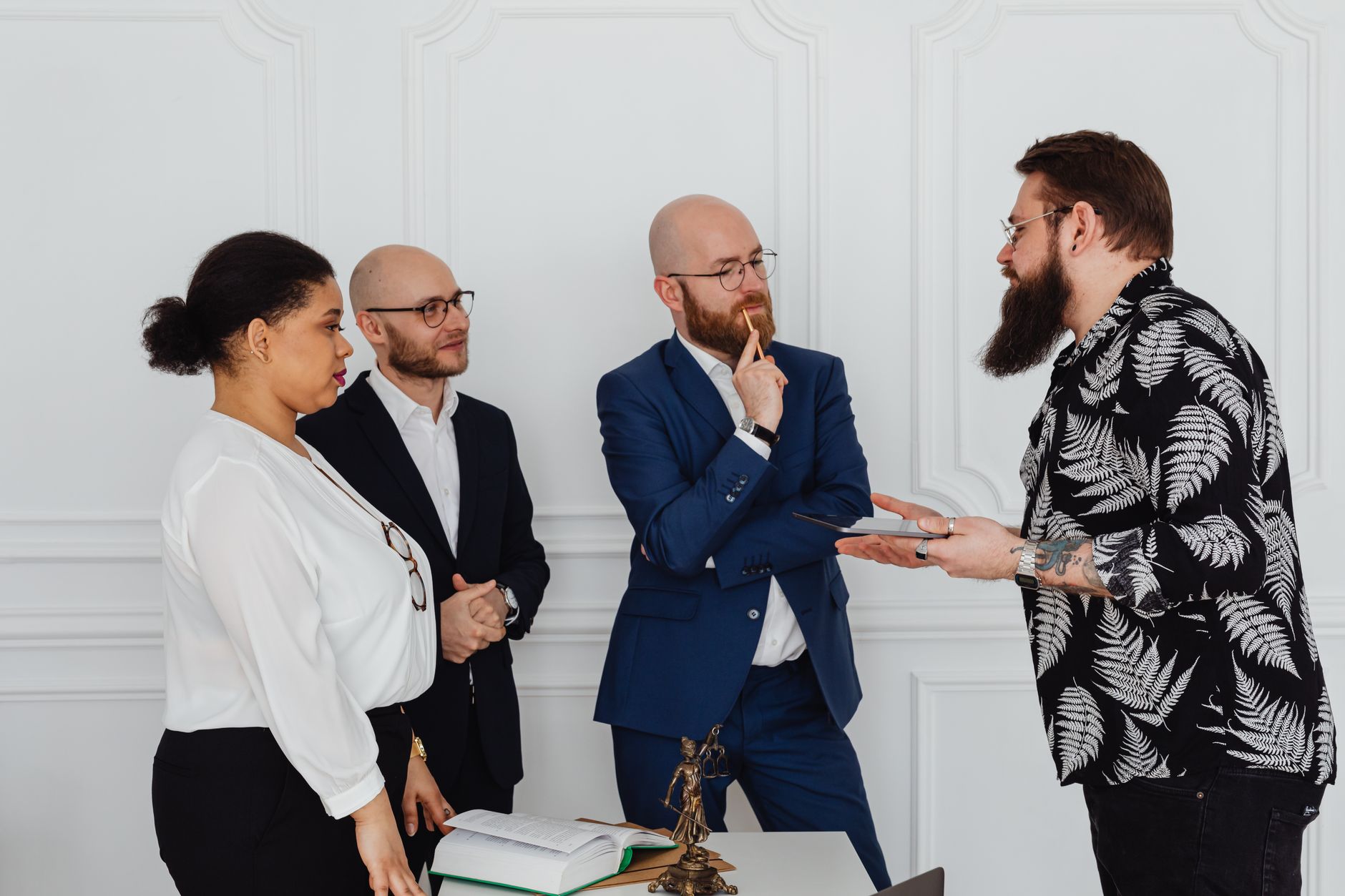 Employment lawyer SEO content meeting - professionals discussing documents in a modern law office