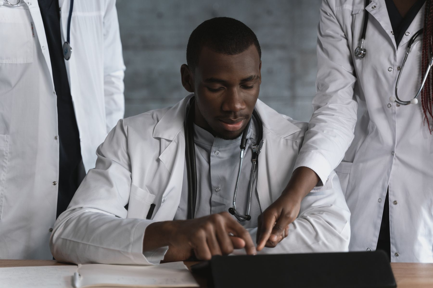 Gastroenterologists discussing a case together, representing medical expertise and credentials