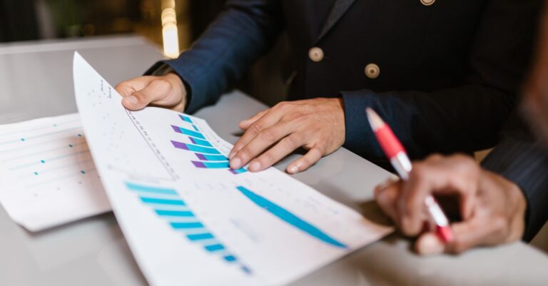 Small business owner reviewing competitor website rankings on a laptop dashboard