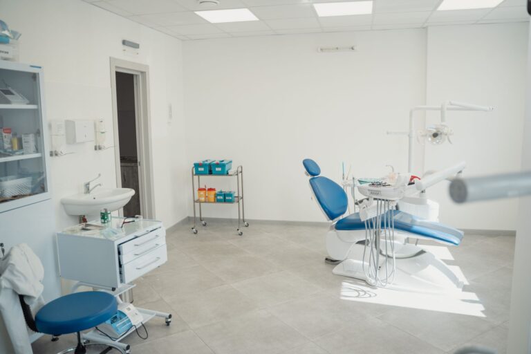 Modern oral surgery clinic interior with dental chair and equipment