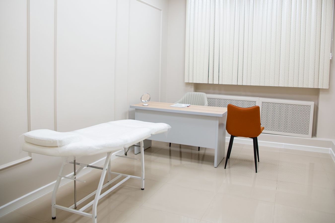 Clean medical examination room set up for a patient visit