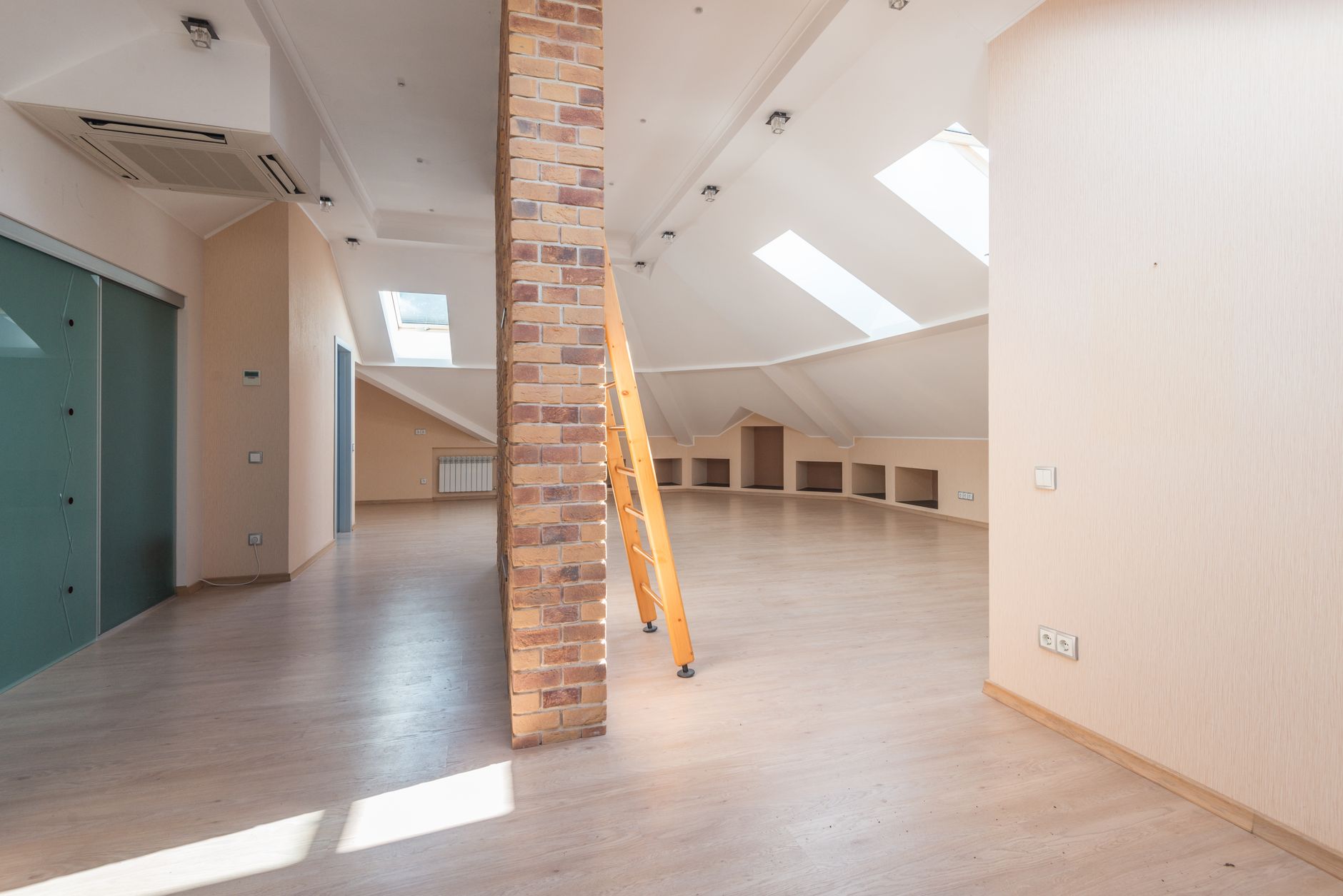 Attic space with blown-in insulation covering the floor joists